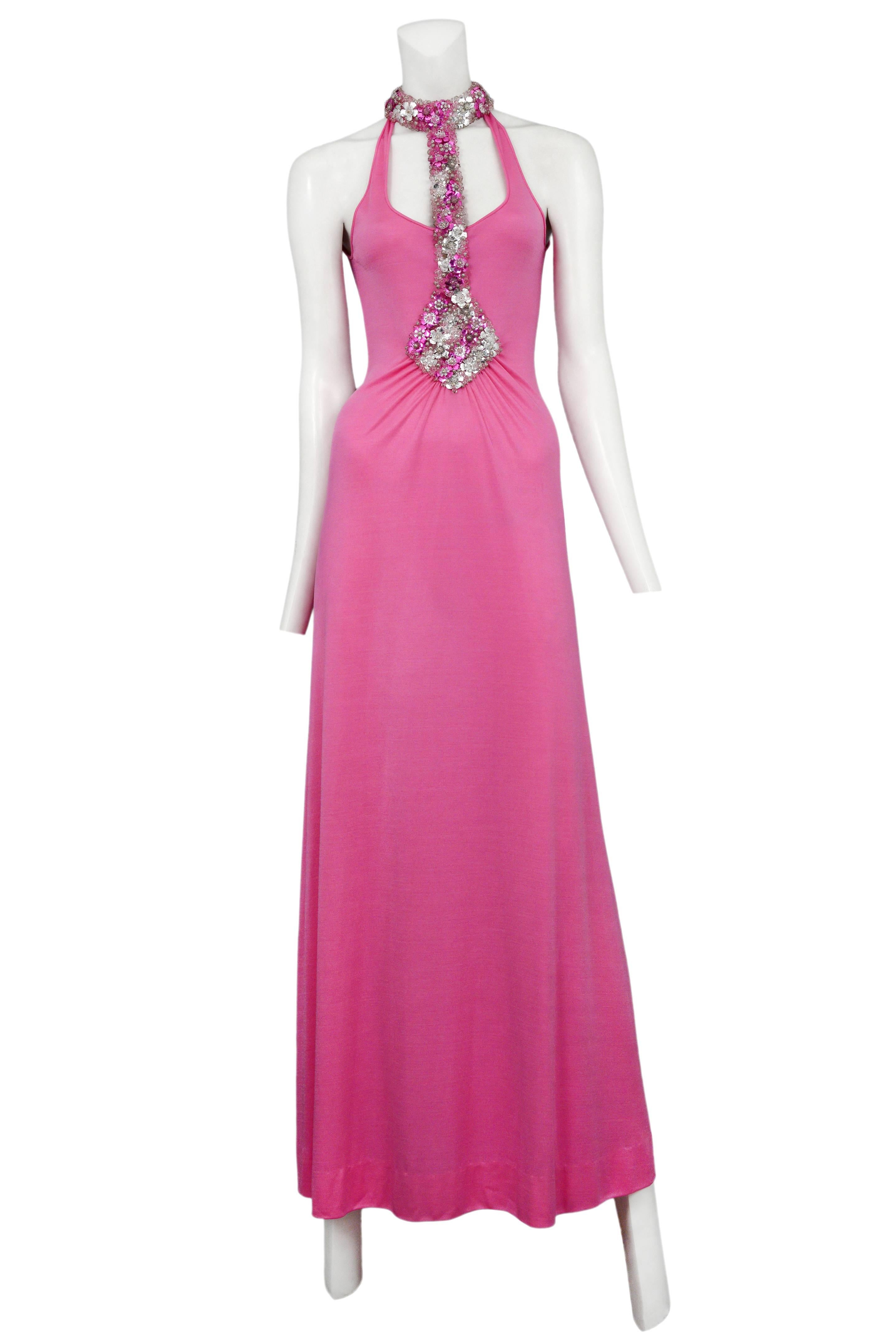 Vintage Loris Azzaro pink sleeveless maxi gown featuring pink and silver floral beading along the waist to neck collar harness, gathering at the waist and an open back.
Please inquire for additional images.