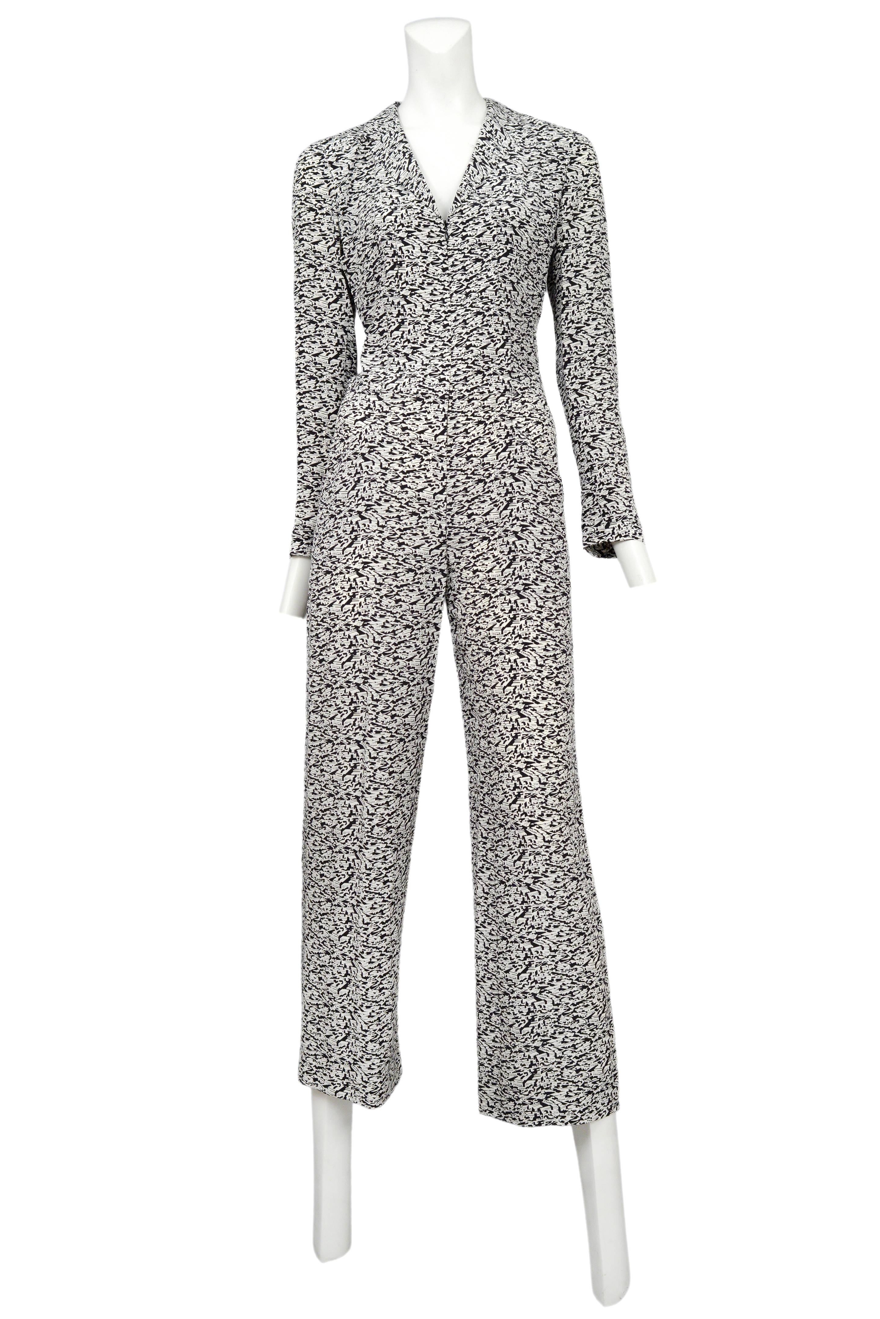 Vintage Chanel long sleeve jumpsuit featuring an allover black and white graphic city print.
Please inquire for additional images.