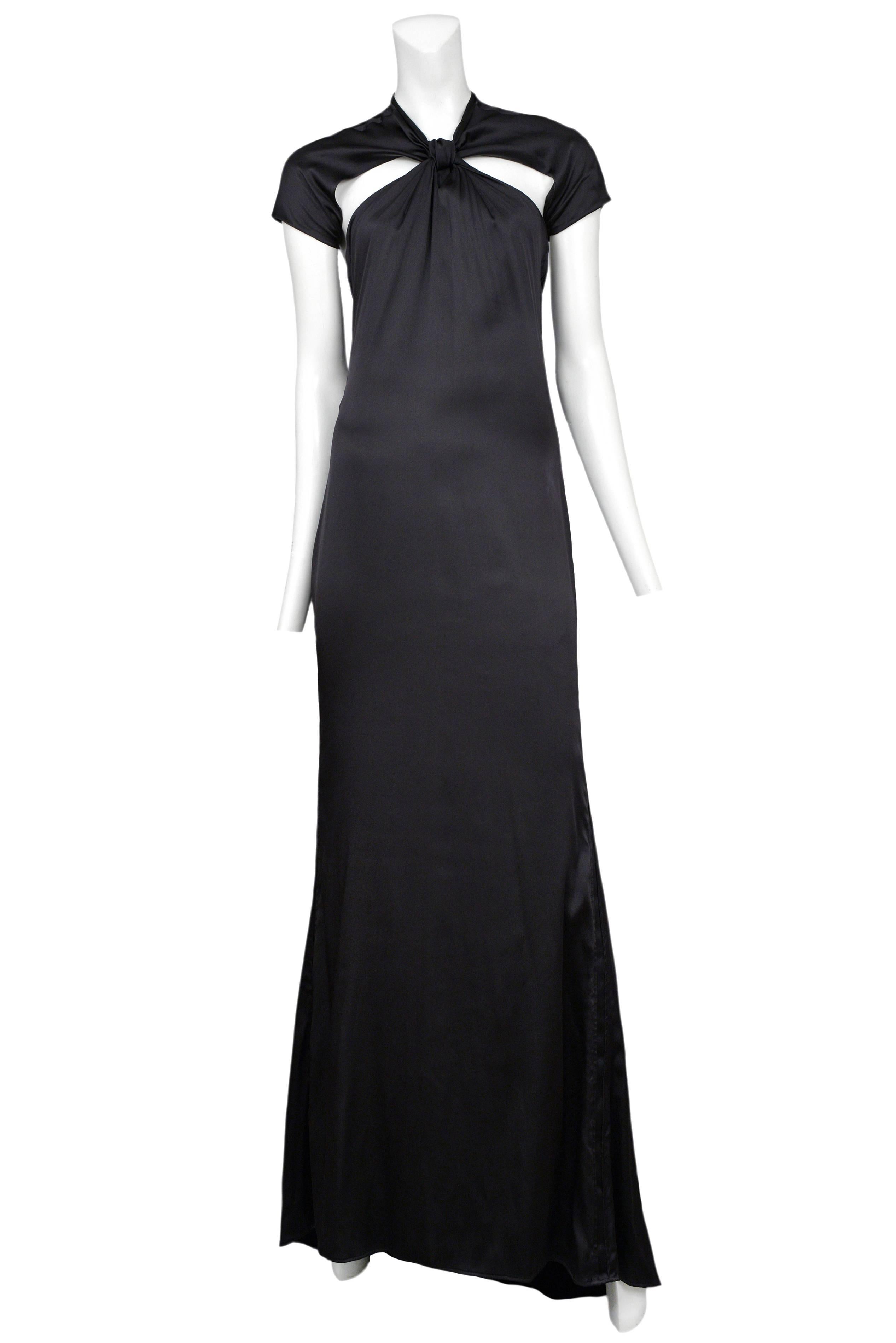 Vintage Tom Ford for Gucci black satin gown featuring cap sleeves, a knot at the collar connecting the bust and sleeves and an open back.
Please inquire for additional images.