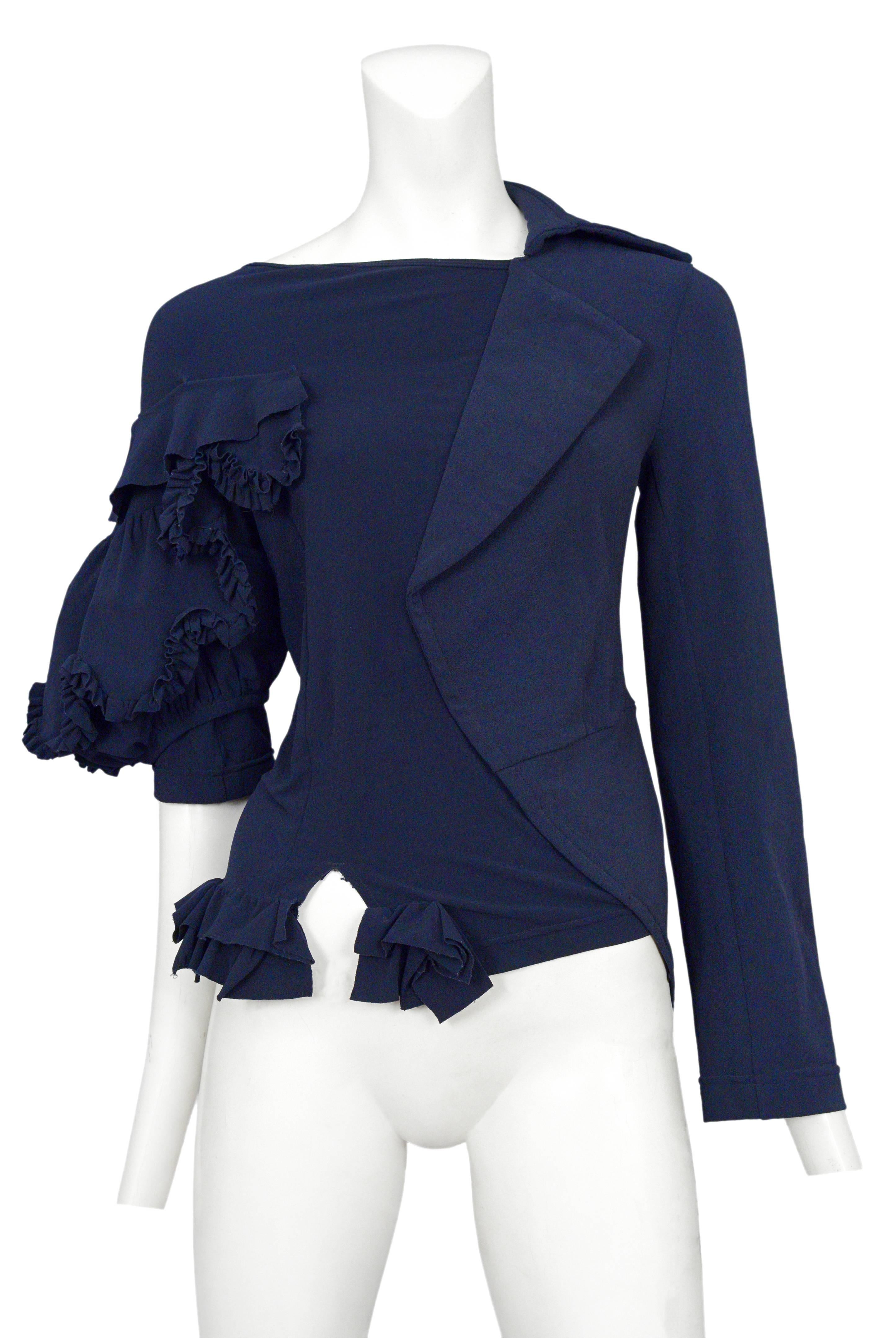Vintage Comme des Garcons navy top featuring abstract ruffles on the 3/4 length right sleeve and a faux tuxedo jacket attached to the left sleeve. Circa 2007.