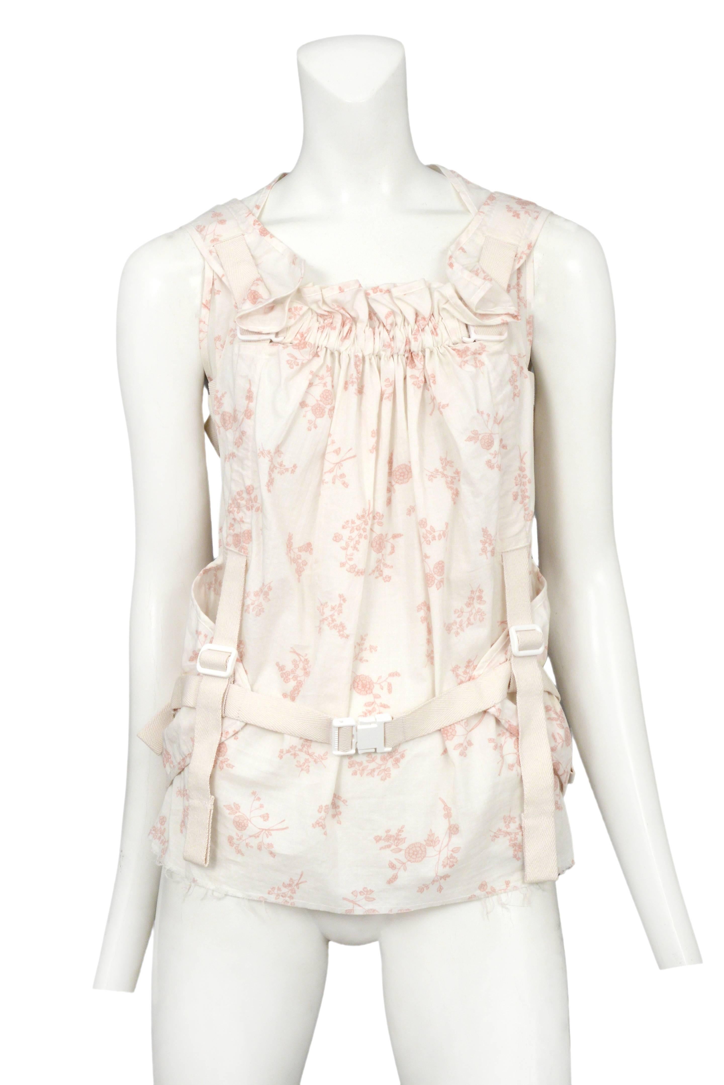 Vintage Junya Watanabe sleeveless parachute top featuring an allover pink and white floral print. Circa 2003.
Please inquire for additional images.