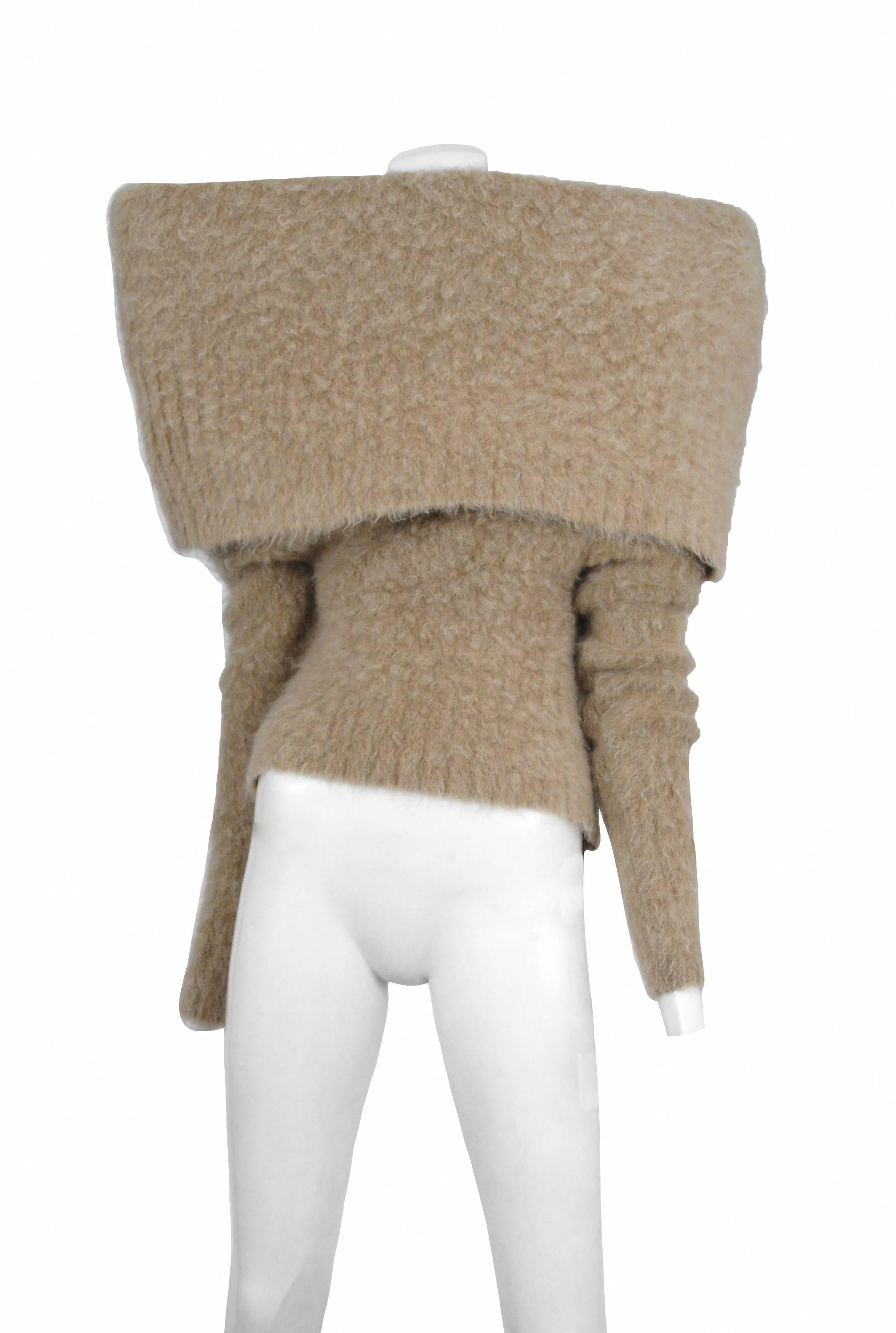 Vintage Maison Martin Margiela beige mohair wool blend long sleeve sweater with oversize fold over collar. Circa 2008/2009.
Please inquire for additional images.