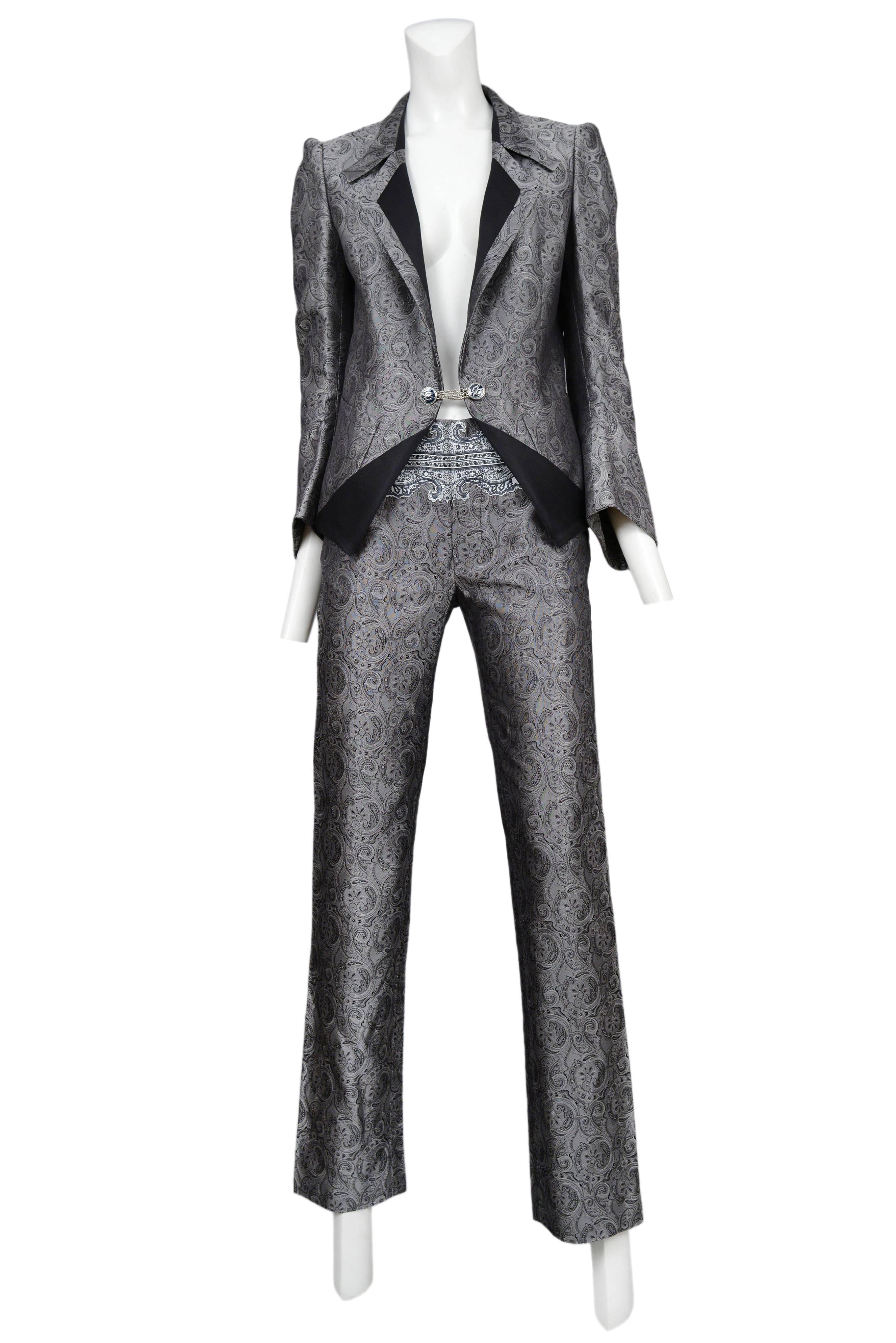 Vintage Nicolas Ghesquière for Balenciaga silver paisley suit featuring a fitted blazer with black trim and chain link buttons and matching pants adorned with a Baroque style print at the upper waist. Runway ensemble from the Spring / Summer 2006