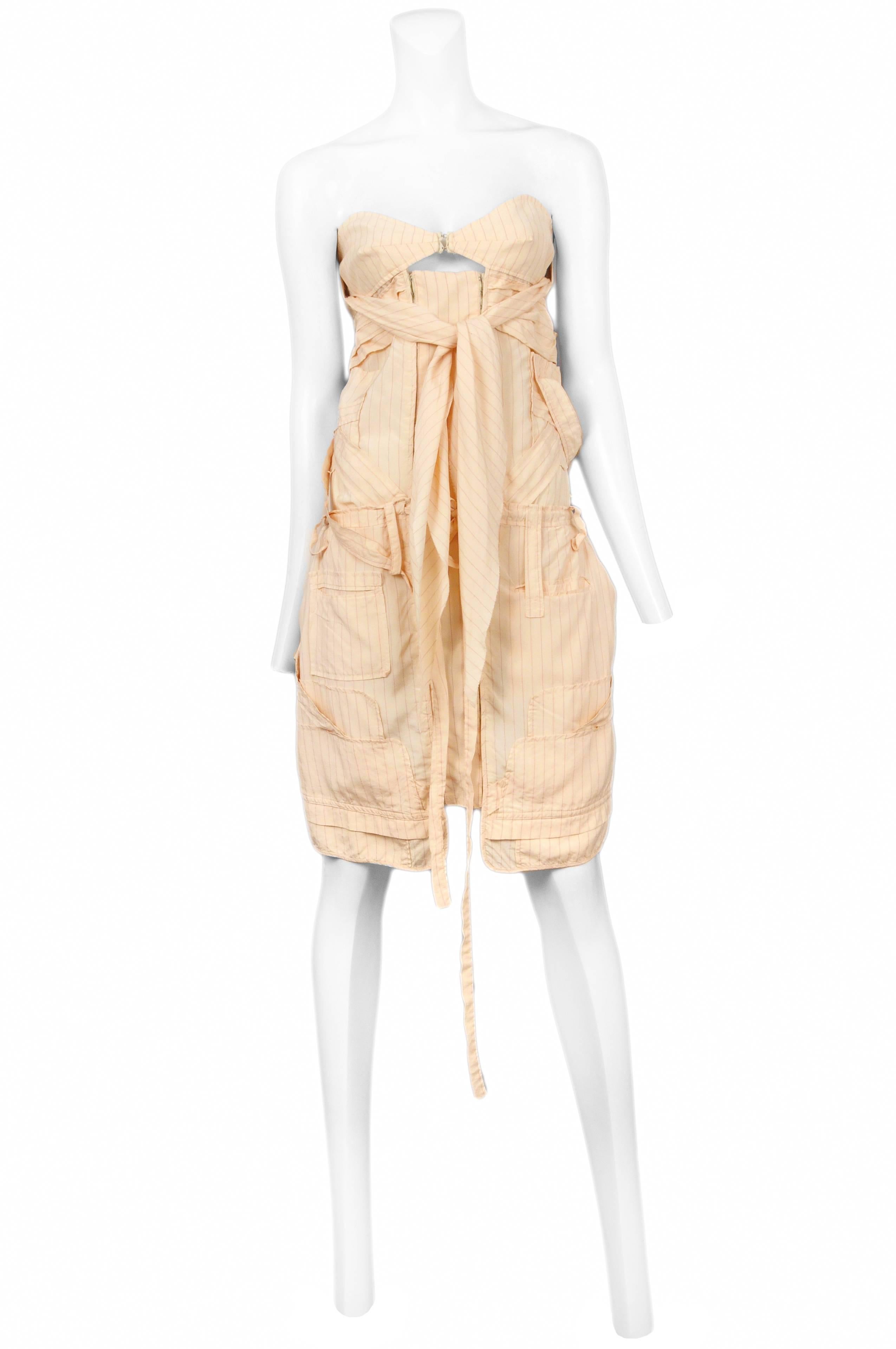 Vintage Nicolas Ghesquière for Balenciaga butter yellow pin stripe knee length dress featuring a strapless bra at the chest that anchors the lose fitting double zipper front dress, abstract pockets throughout and sashes below the bust and at the