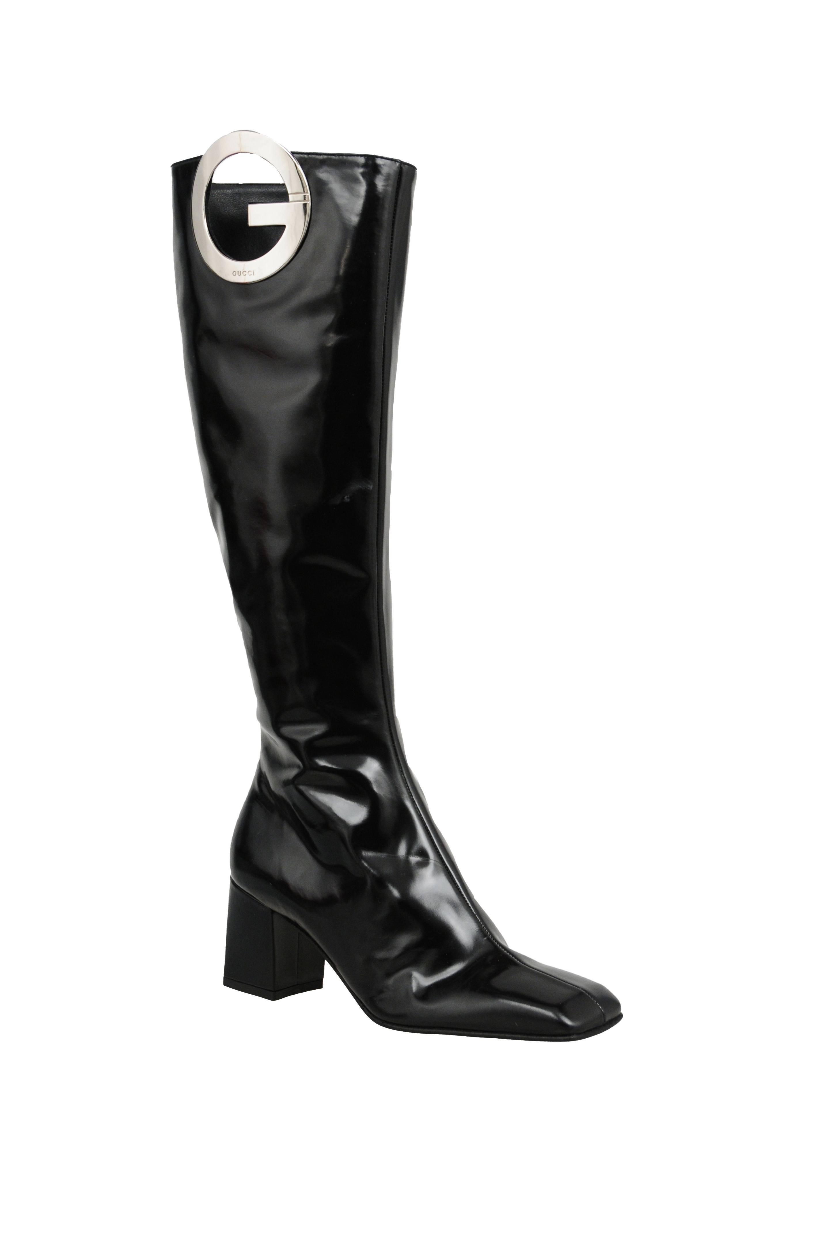 Vintage Tom Ford for Gucci black leather tall boot with silver 'G' logo detail. Zip closure at side.
Please inquire for additional images.
