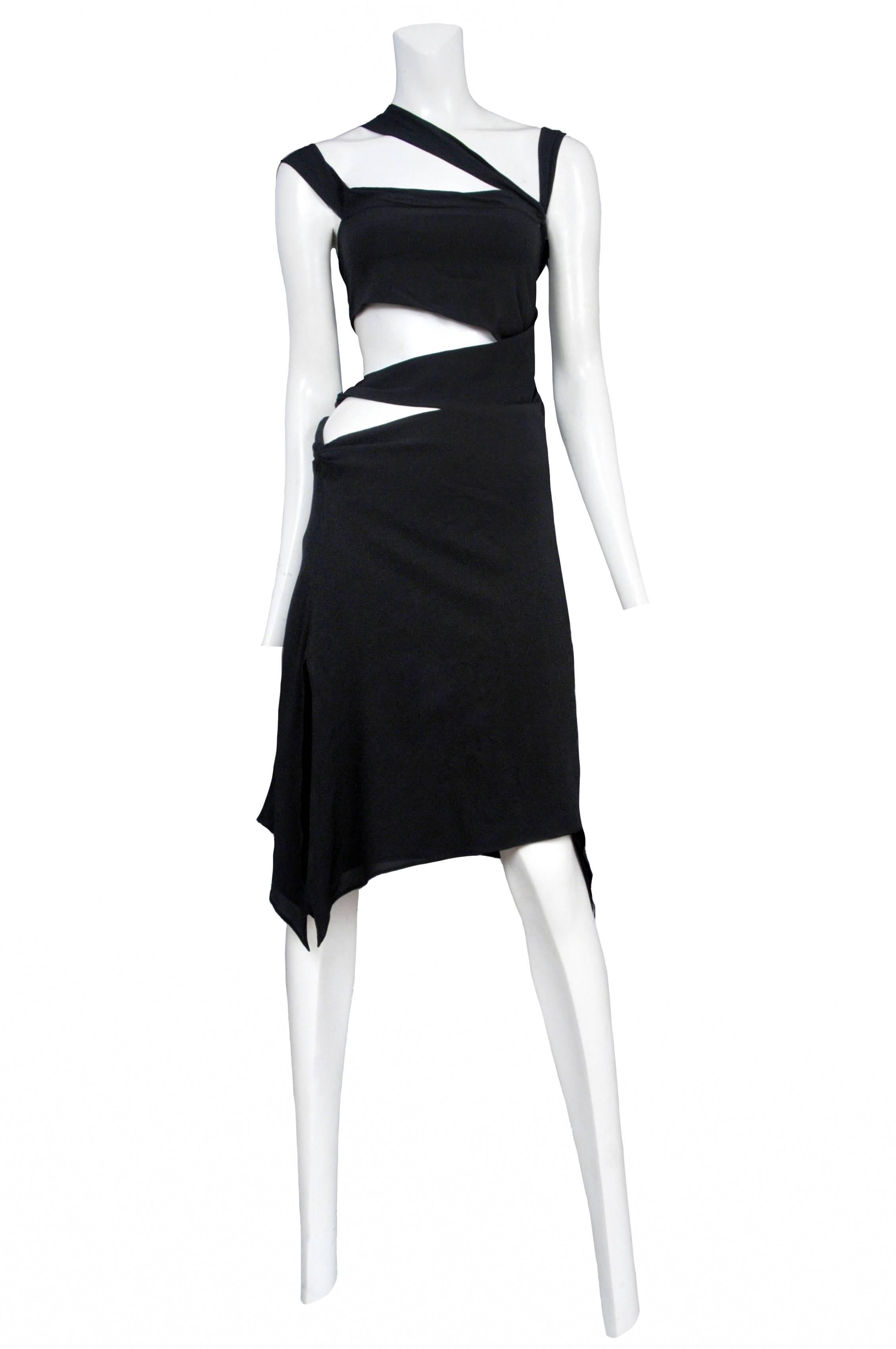Vintage Tom Ford for Gucci black jersey knee length dress featuring cutouts at the sides and straps at the shoulders. Circa 2003.
Please inquire for additional images.
