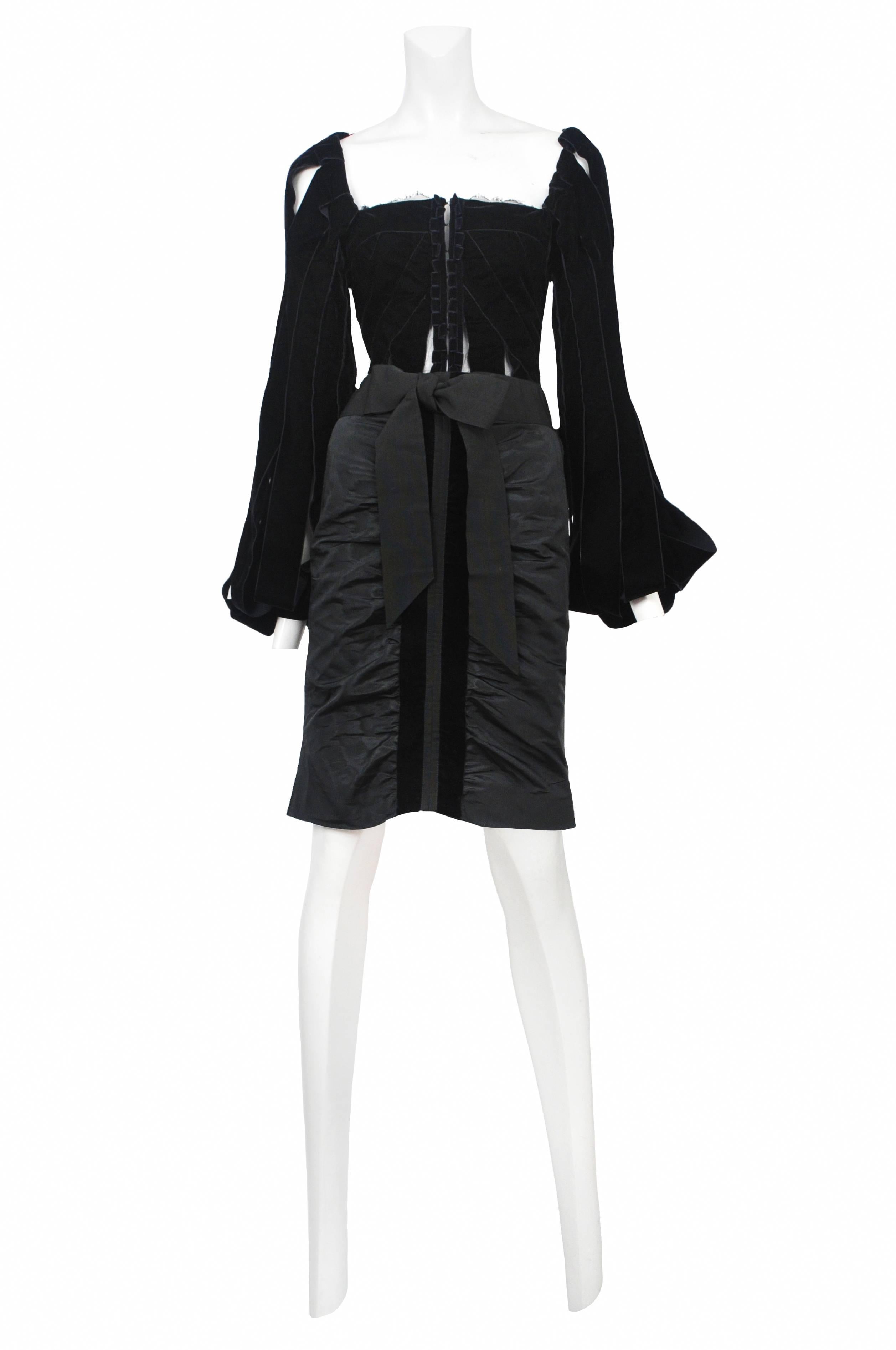 Vintage Tom Ford for Yves Saint Laurent velvet ribbon ensemble featuring a velvet corset style bodice and a gathered satin skirt finished with grosgrain ribbon detailing. Runway look from the Fall 2002 Collection.
Please inquire for additional