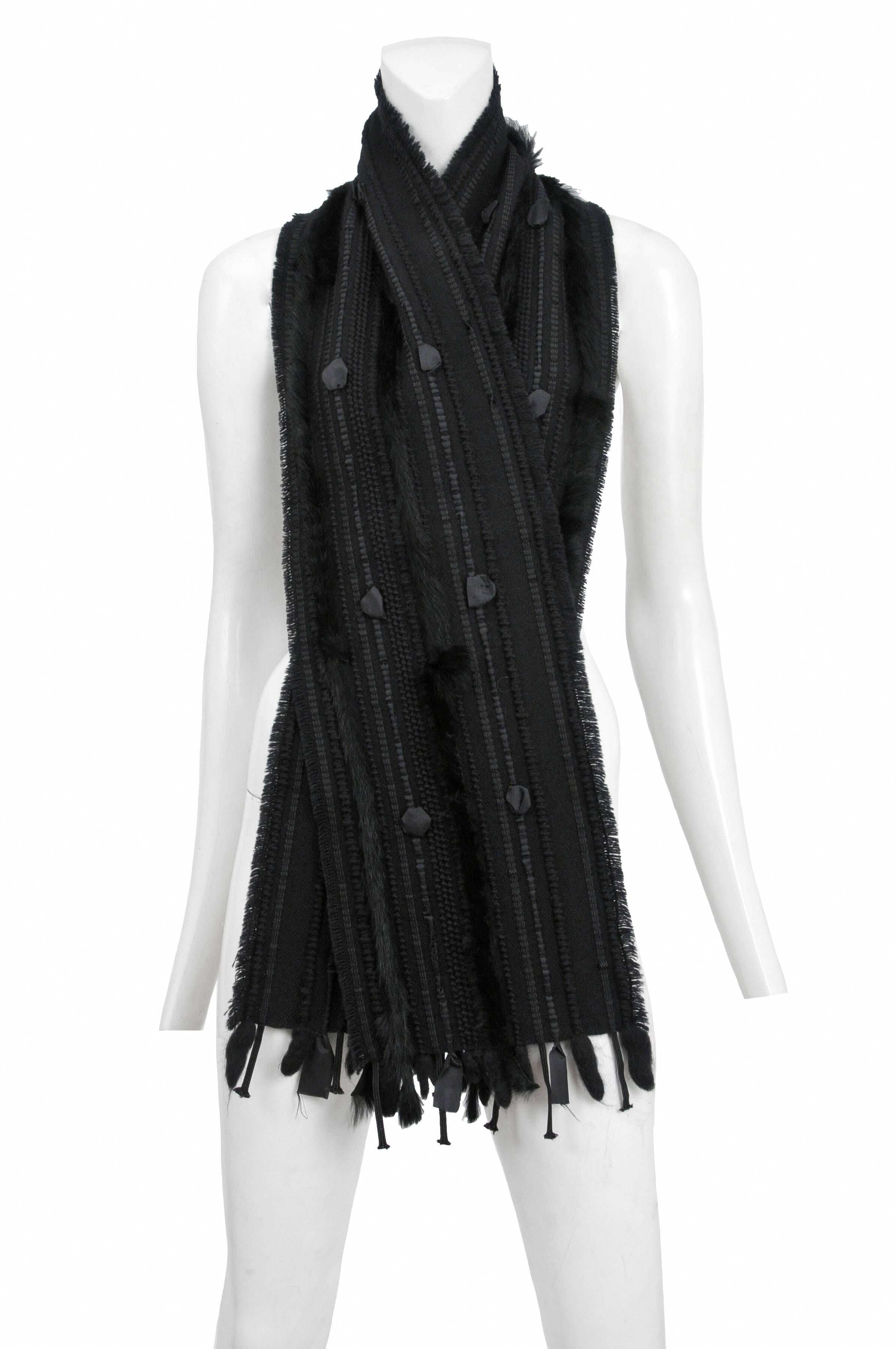 Vintage Tom Ford for Gucci black woven and fur scarf with feathers. Circa 2002.
Please inquire for additional images.