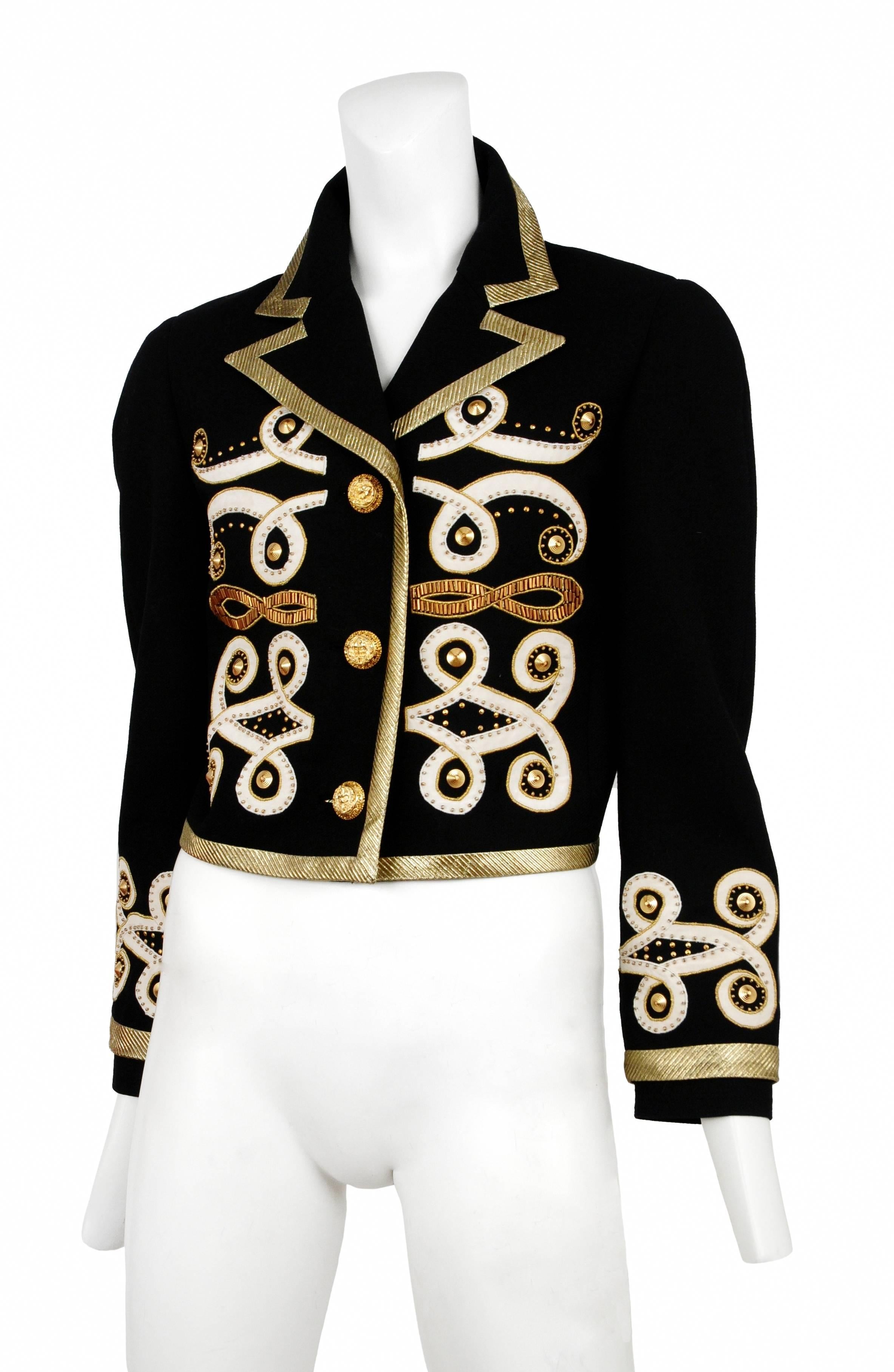 Vintage Gianni Versace black wool jacket has gold fabric trim and applique details with gold Medusa button.
Please inquire for additional images.