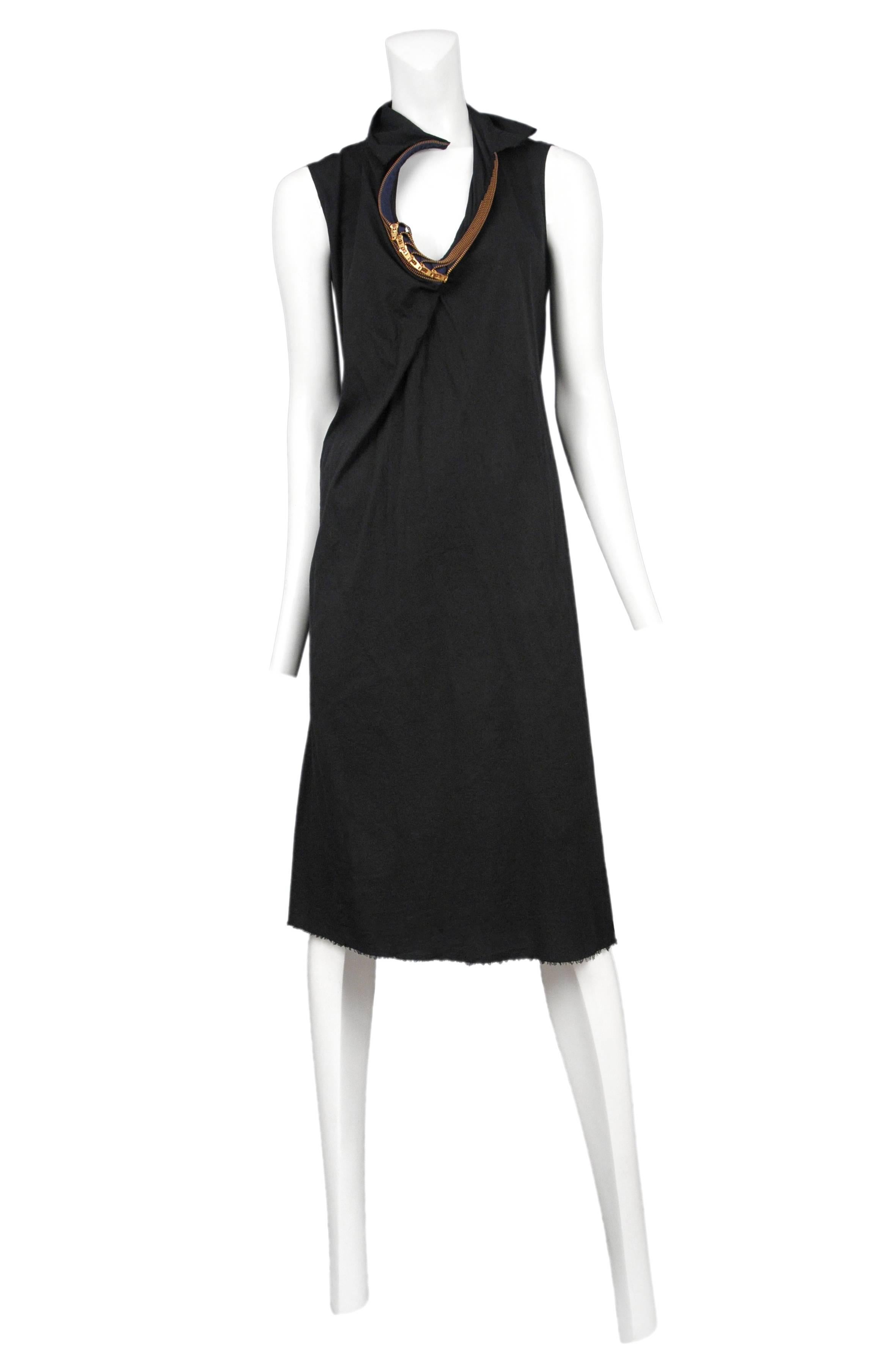 Vintage Junya Watanabe black cotton sleeveless knee length dress featuring multiple brass zippers encircling the collar. Runway piece from the Spring / Summer 2005 Collection.
Please inquire for additional images.