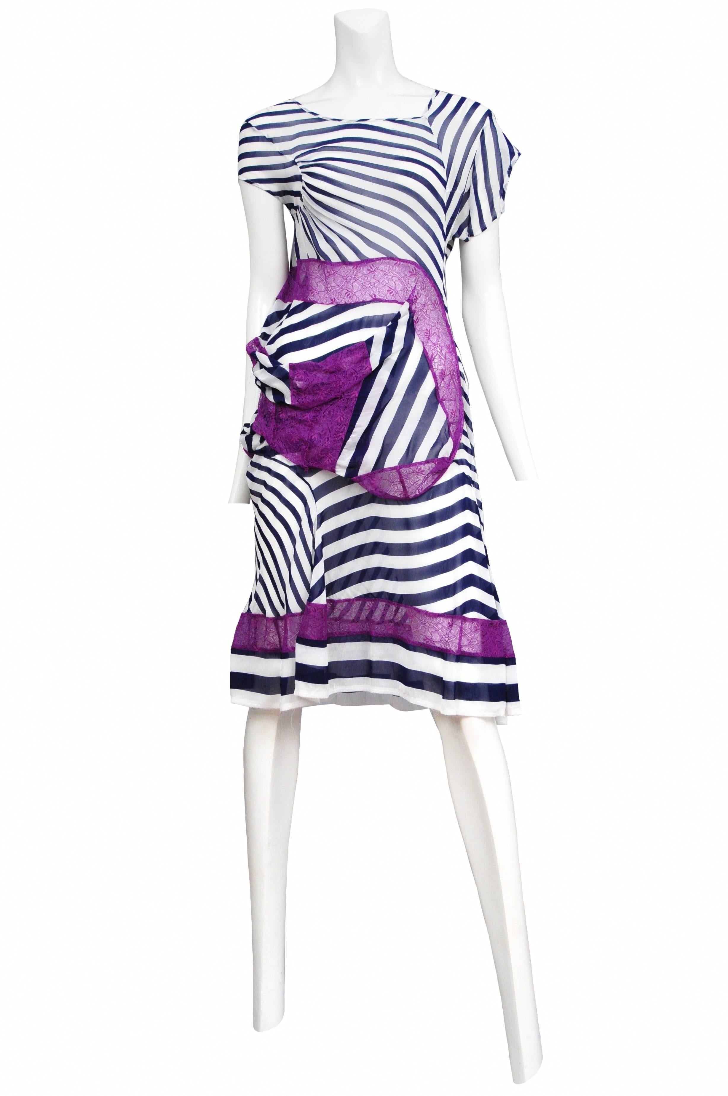Vintage Junya Watanabe white and navy stripe knee length dress featuring abstract cap sleeves and purple lace draped throughout bodice and lining the hem.  Runway piece from the Spring / Summer 2011 Collection.
Please inquire for additional images.