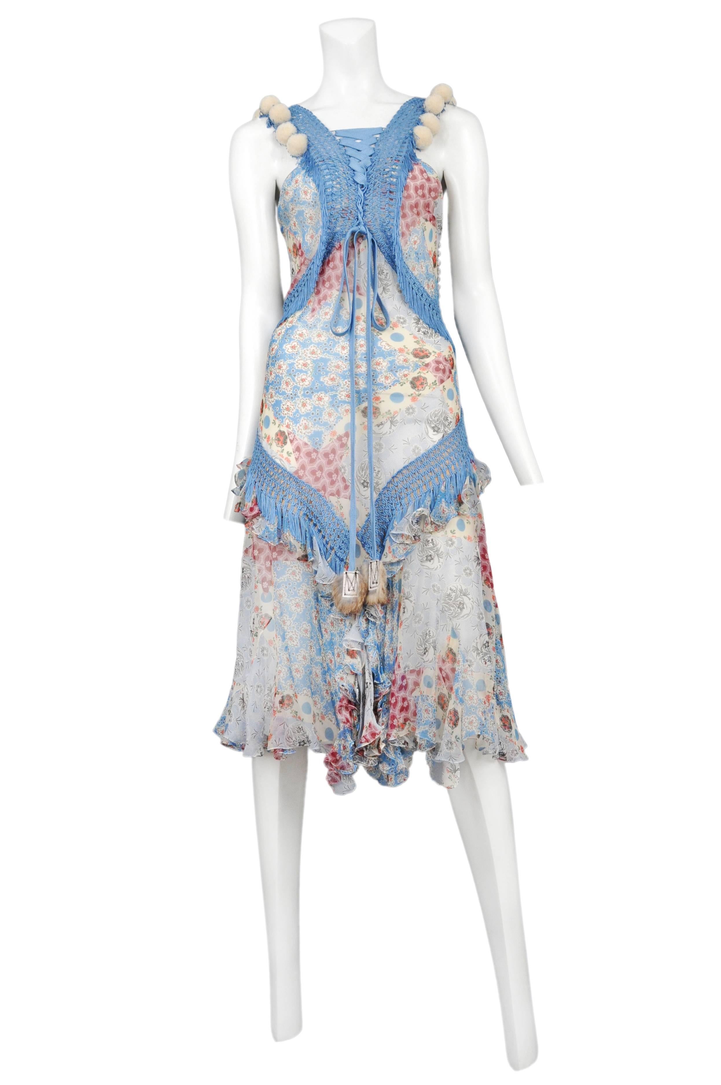Vintage John Galliano for Dior floral printed dress featuring blue crochet detailing at the bust and hips, white pom poms adorning the shoulder straps and fur tassels at the ends of the front lace up ties. Runway piece Circa 2002.
Please inquire
