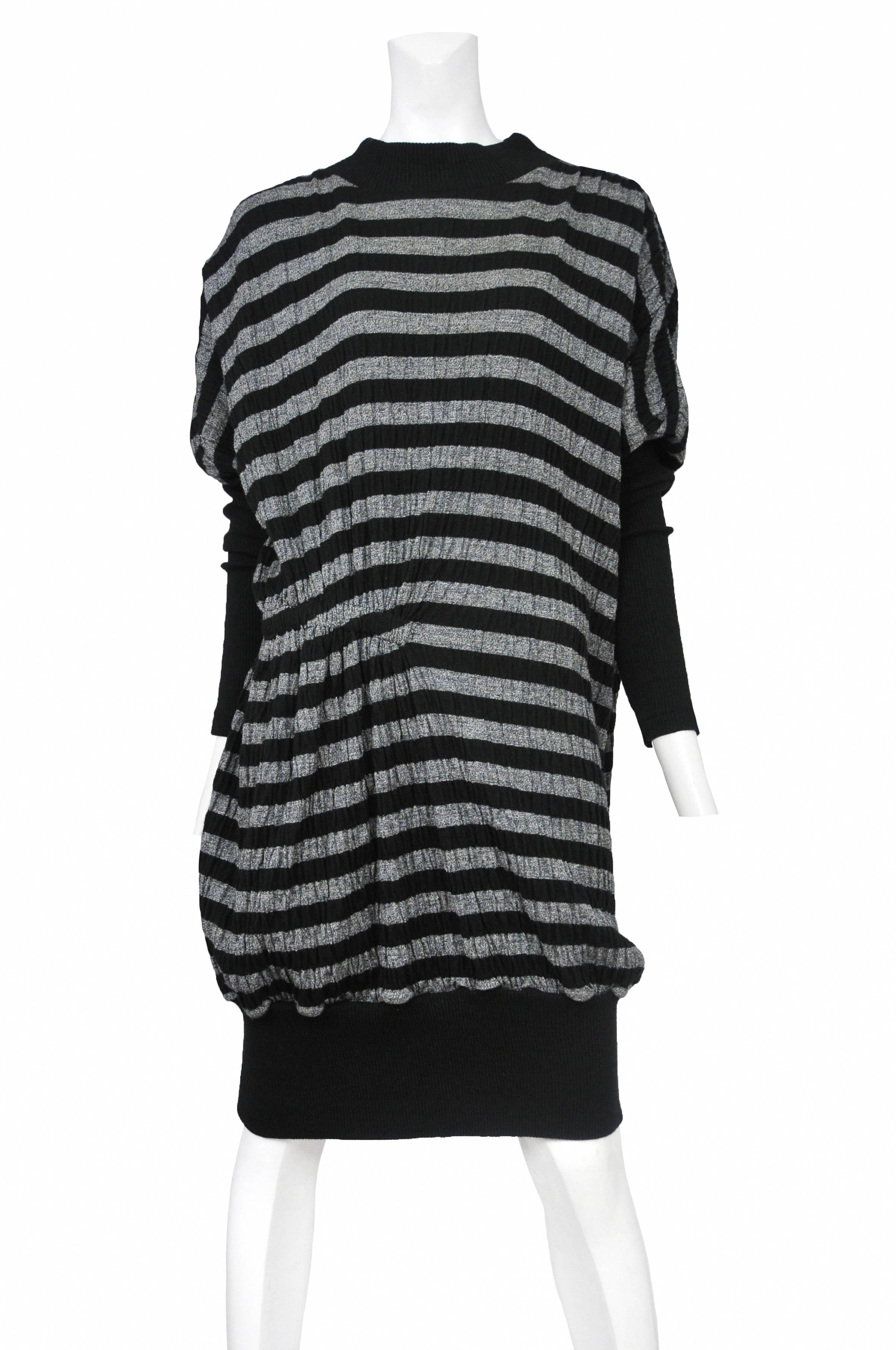 Vintage Issey Miyake wool blend crinkle long sleeve dress with black and grey horizontal stripes throughout body and black rib contrast at collar, sleeves and hem.
Please inquire for additional images.