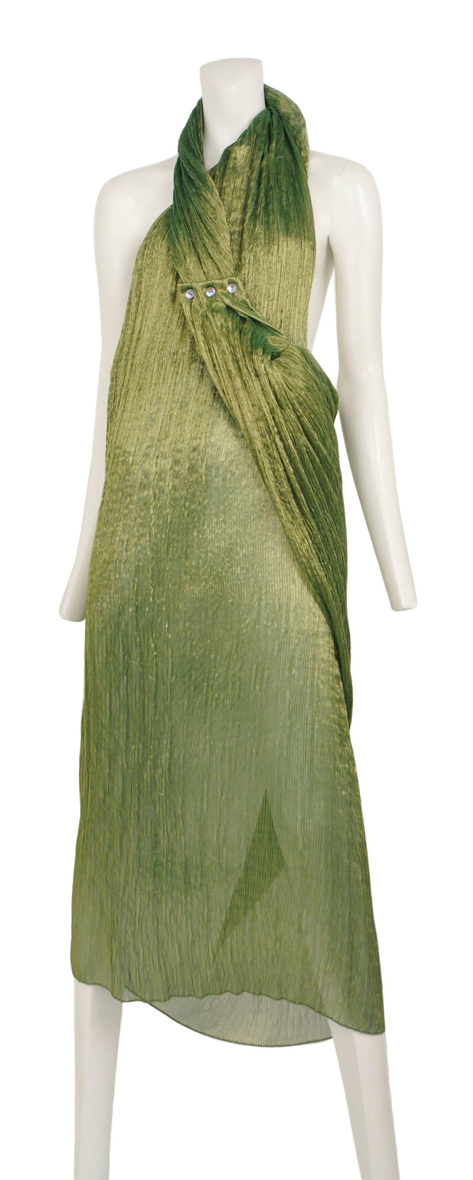 Vintage Romeo Gigli crinkle green wrap dress featuring a halter style collar that wraps around the neck and fastens with three buttons at the bust.
Please inquire for additional images.