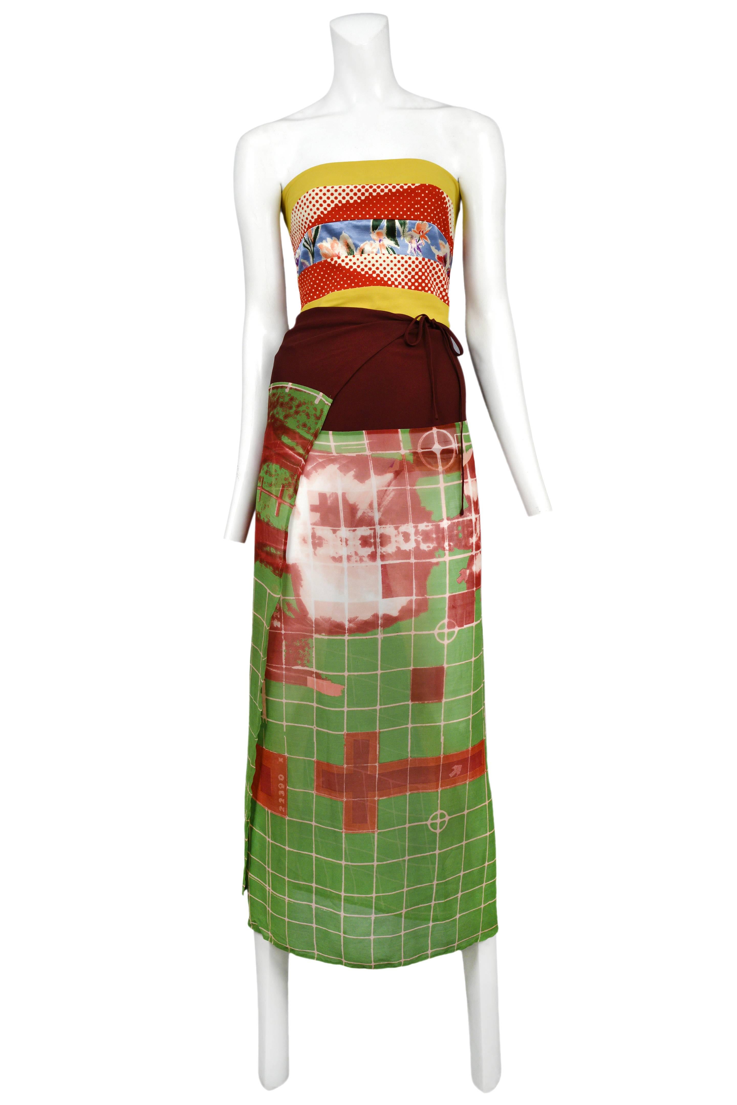 Vintage Jean Paul Gaultier strapless wrap dress featuring a fitted bandeau style top with mix-matched multicolor prints, that anchors a wrap skirt comprised of a burgundy panel as well as an abstract green and red grid print panel. Circa Spring /