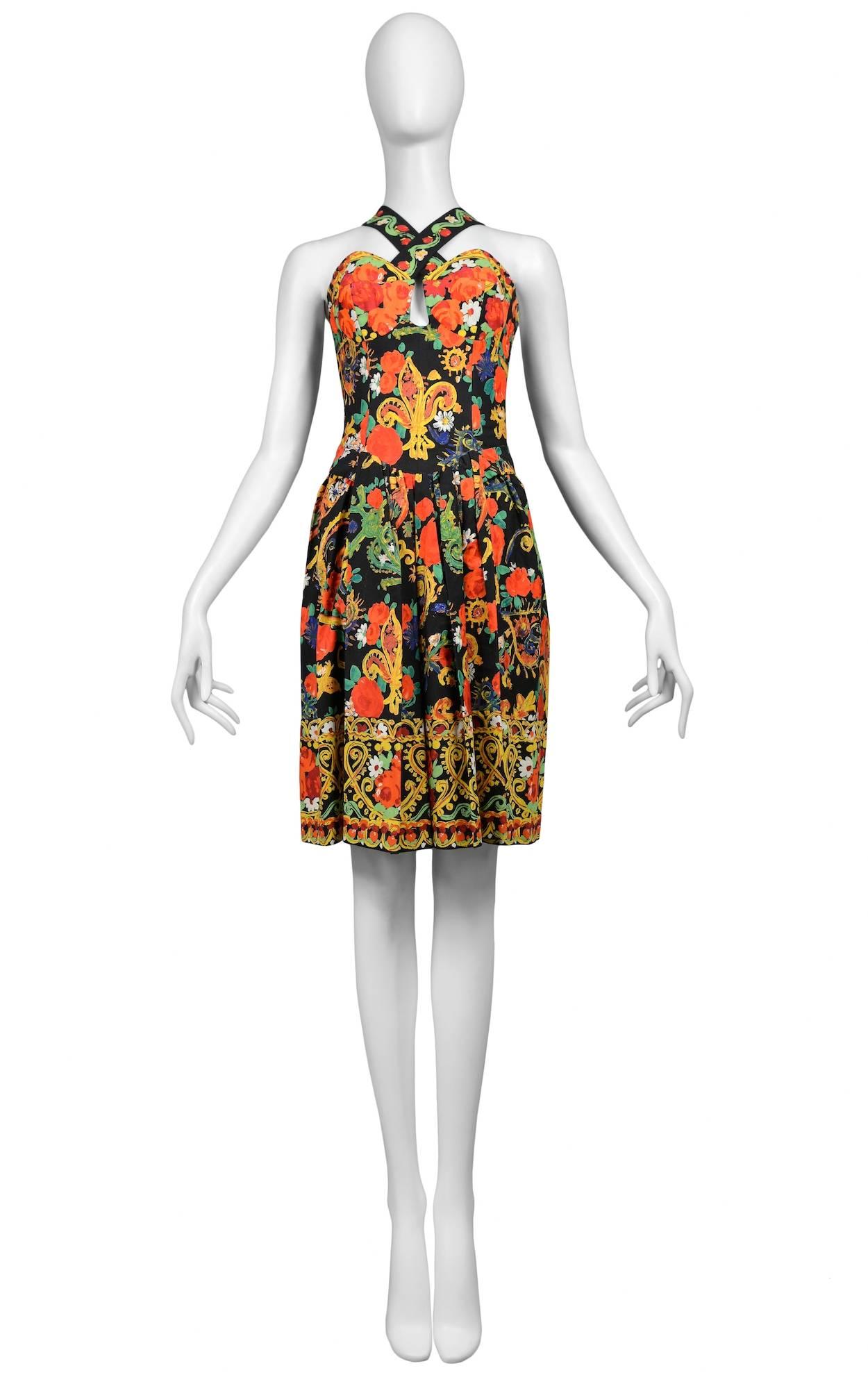 Vintage Christian Lacroix multi color floral bustier dress featuring jewel adorned criss cross straps that overlap in the front and lace up the back through crystal studded grommets.
Please inquire for additional images.
