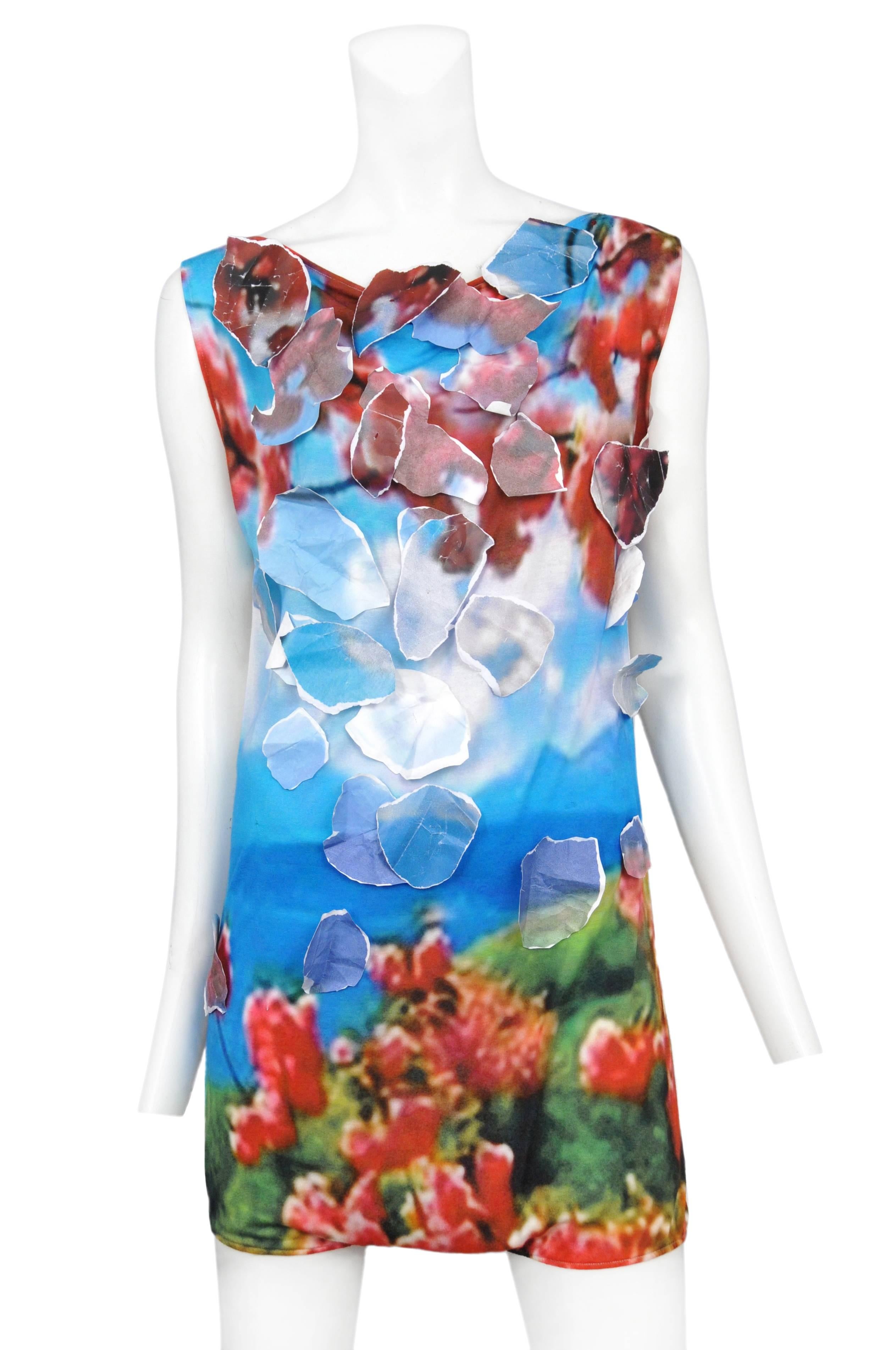 Vintage Maison Martin Margiela romper featuring an allover print of a sky lit garden and adorned with paper pieces that blend into the background. Circa Spring / Summer 2010.
Please inquire for additional images.
