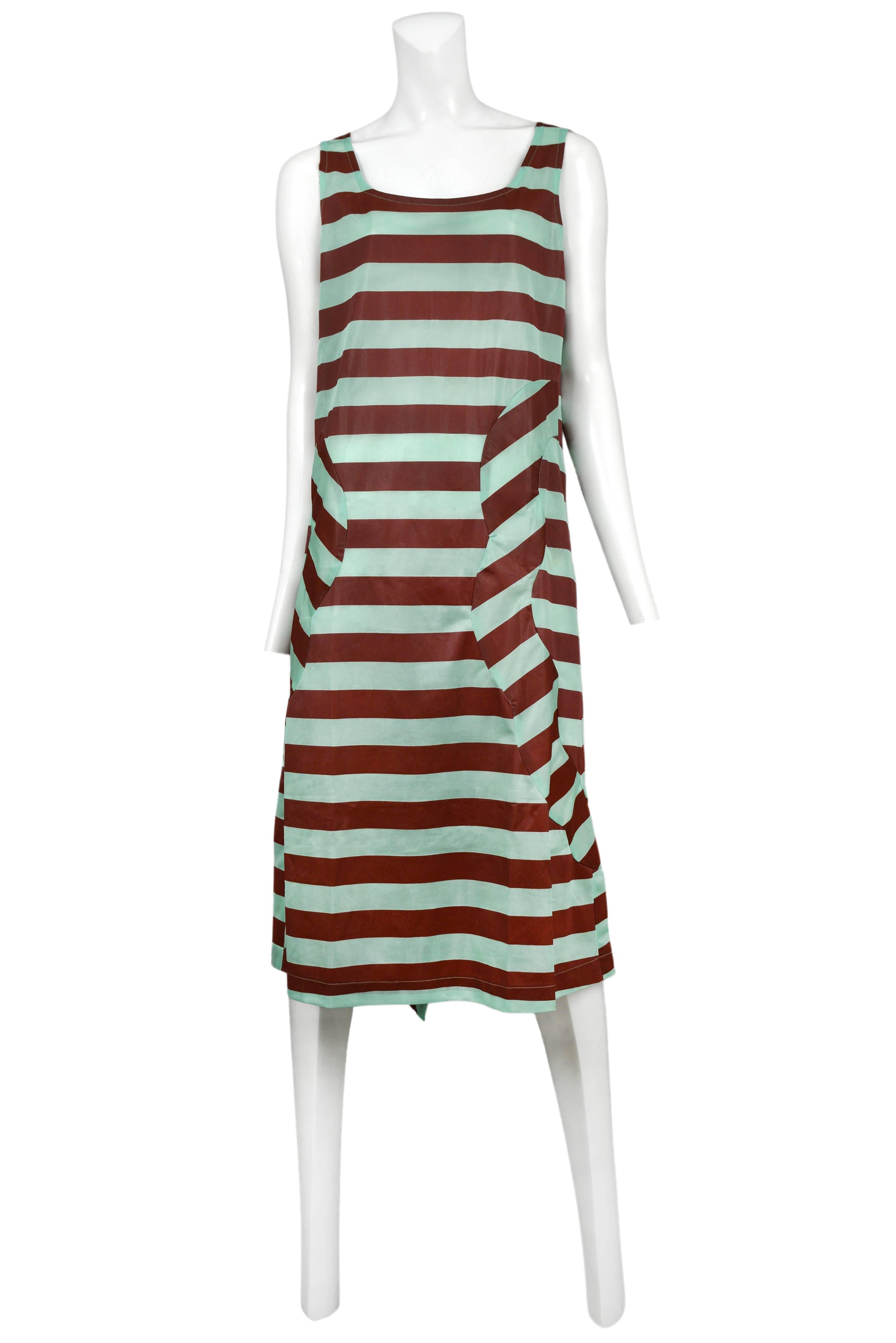 Vintage Comme des Garcons tank dress featuring horizontal rust and mint green stripes. Circa 1996.
Please inquire for additional images.
