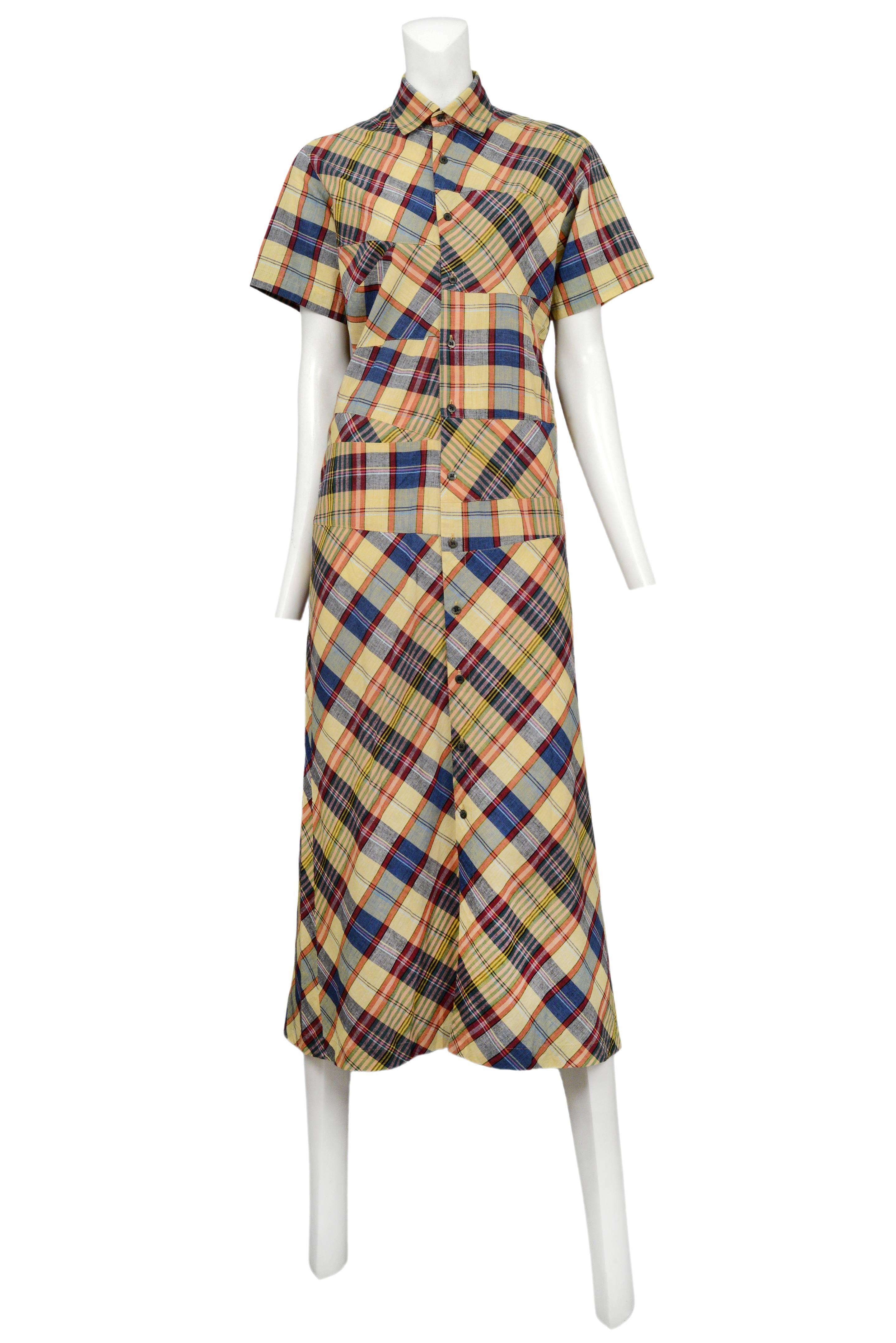 Vintage Comme des Garcons yellow plaid below the knee shirt dress featuring a button front opening, short sleeves and patchwork panels of blue, red and yellow plaid fabric. Circa 1994.
Please inquire for additional images.