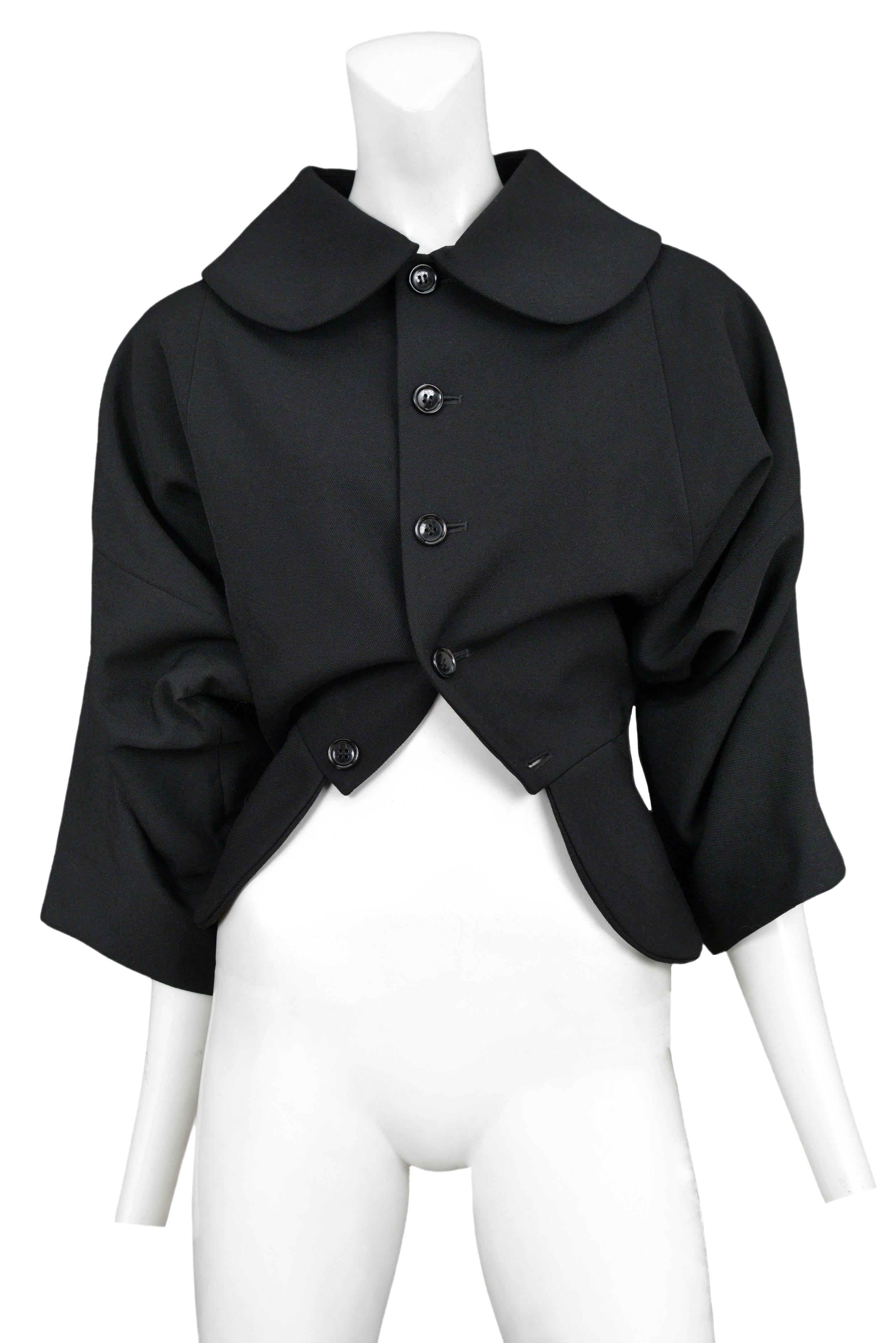 Vintage Comme des Garcons black upside down 3/4 sleeve jacket featuring a button front closure and a large peter pan collar.
Please inquire for additional images.