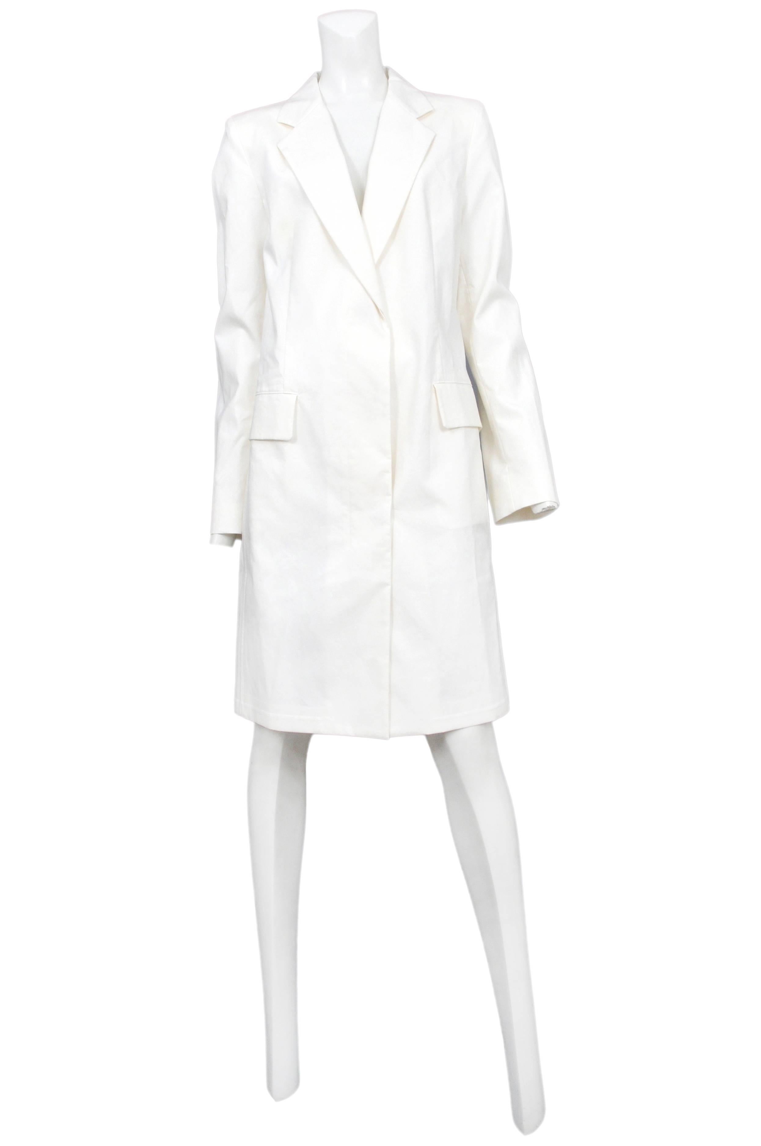 Vintage Maison Martin Margiela white above the knee lab coat featuring hidden buttons and side pockets.
Please inquire for additional images.