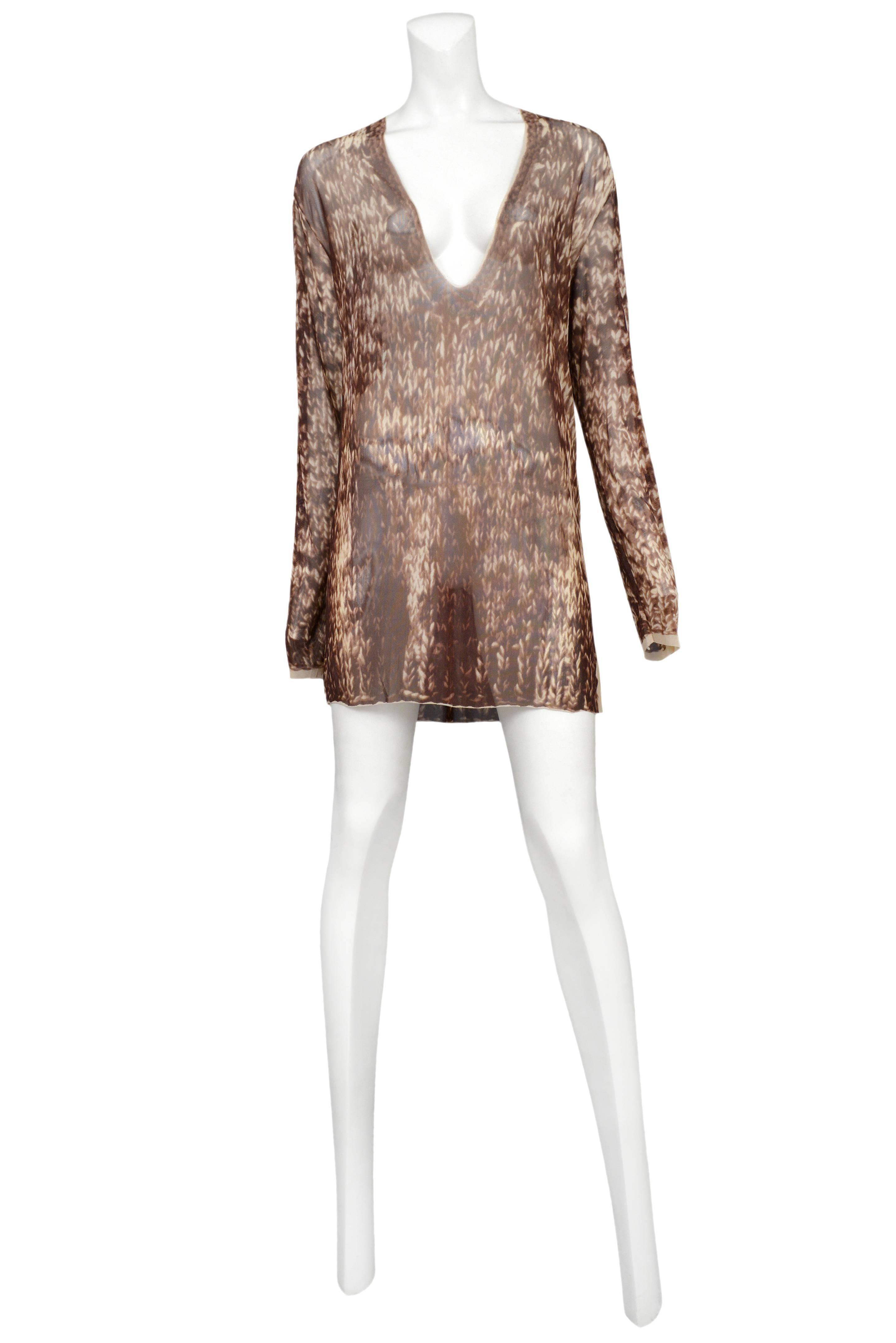 Vintage Maison Martin Margiela sheer v-neck, long sleeve tunic featuring an allover brown trompe l'oeil cable knit print. Circa Spring / Summer 1996.
Please inquire for additional images.