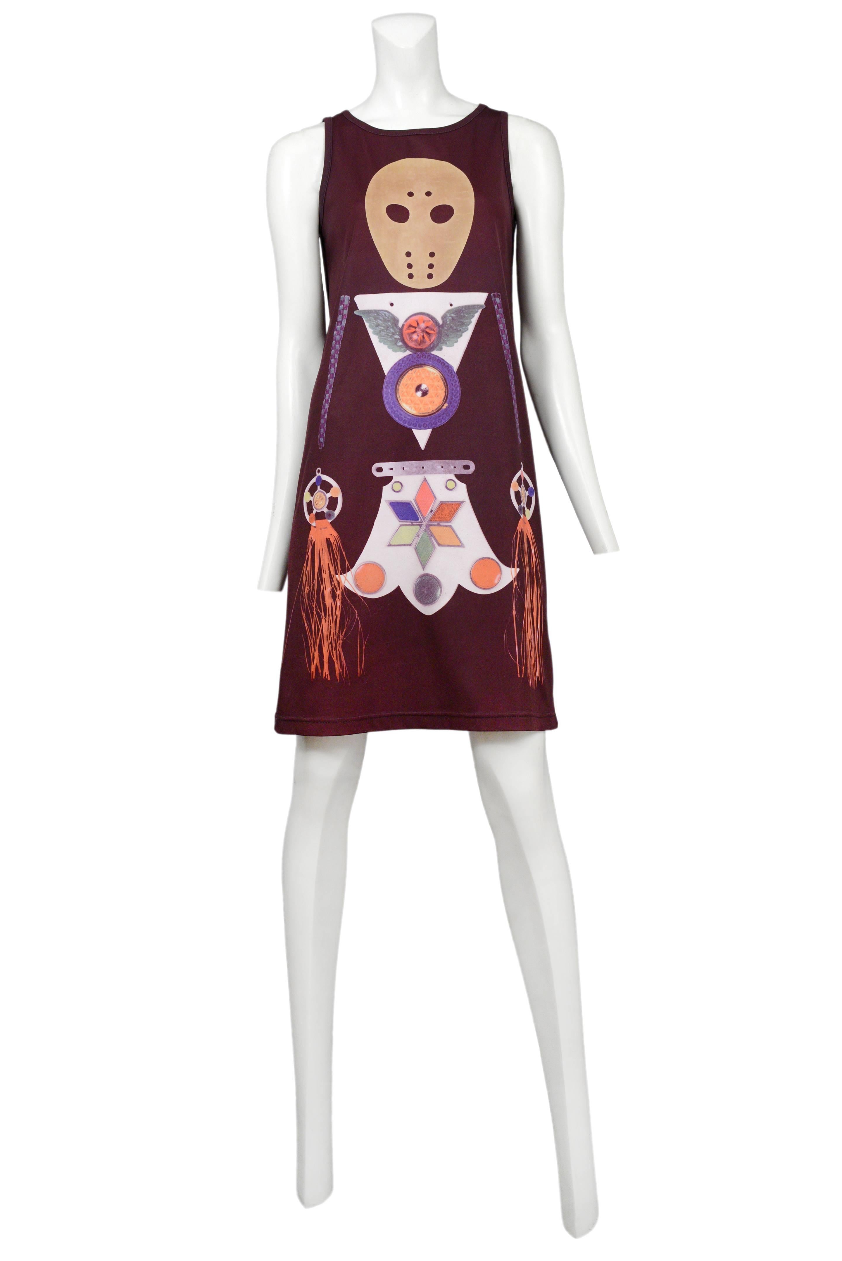 Vintage brown tank dress featuring at tribal mask motif printed on the front. Circa 1998 /1999.
Please inquire for additional images.