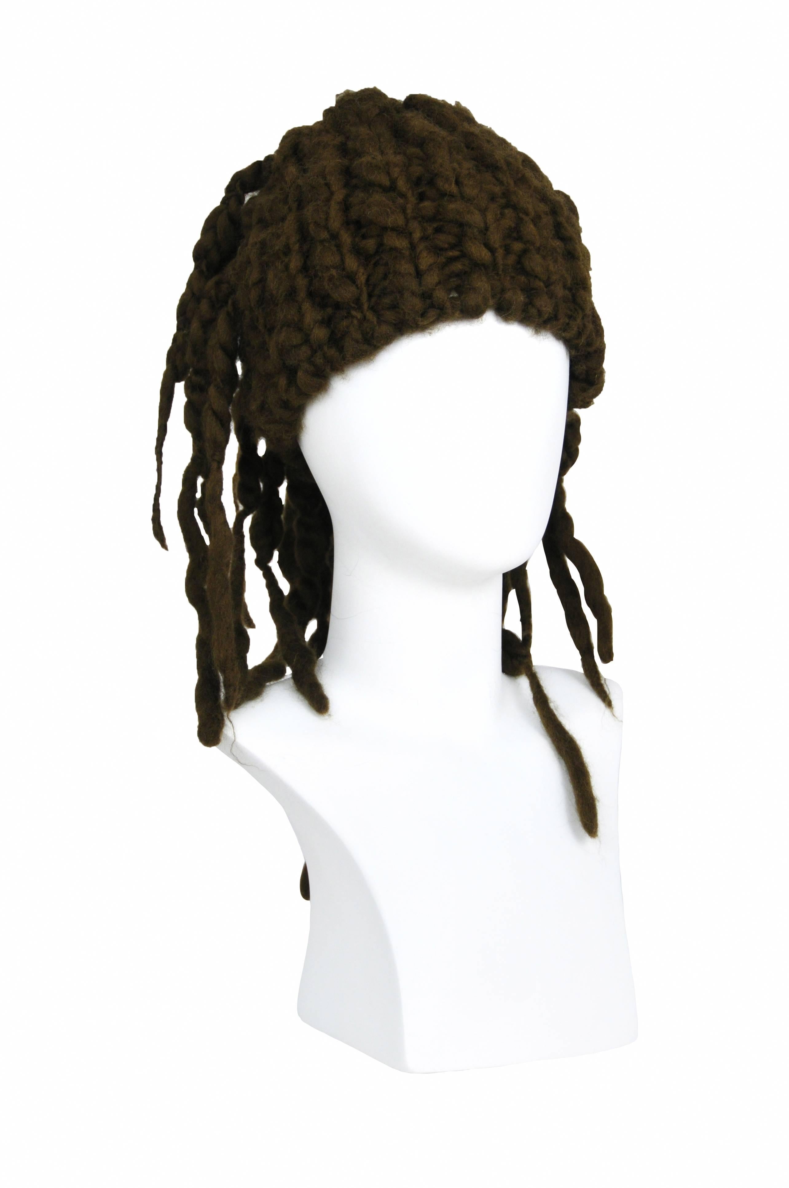 Vintage brown knit hat with dread lock style strands.
Please inquire for additional images.