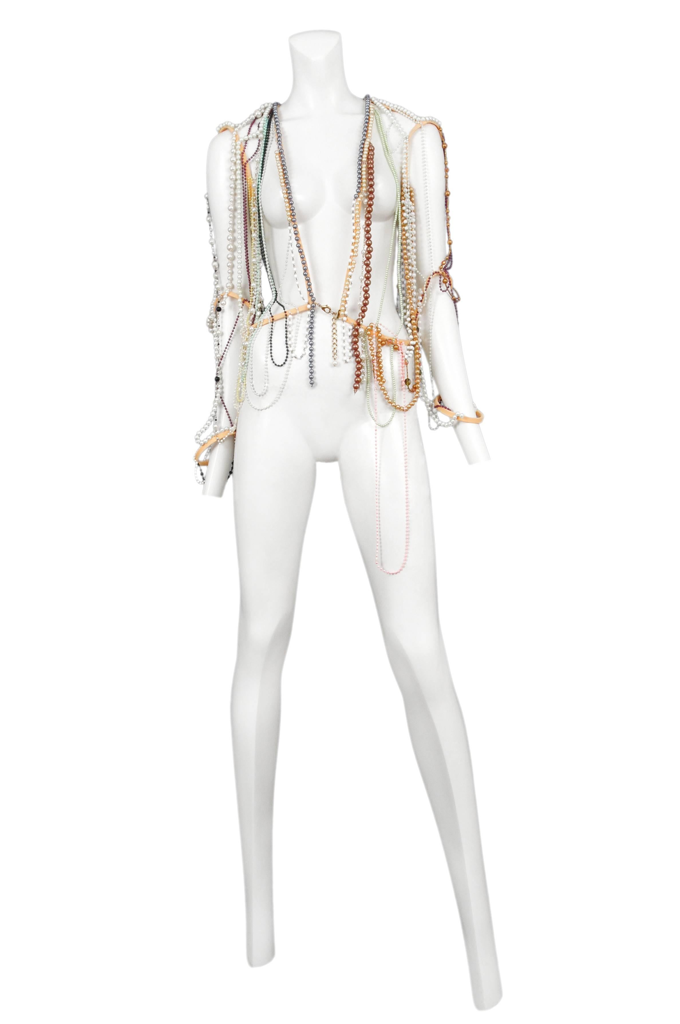 Vintage Maison Martin Margiela artisanal beaded jacket made from various vintage necklaces with hook and jump ring closure at front. 0 collection. Circa Summer 2006.
Please inquire for additional images.