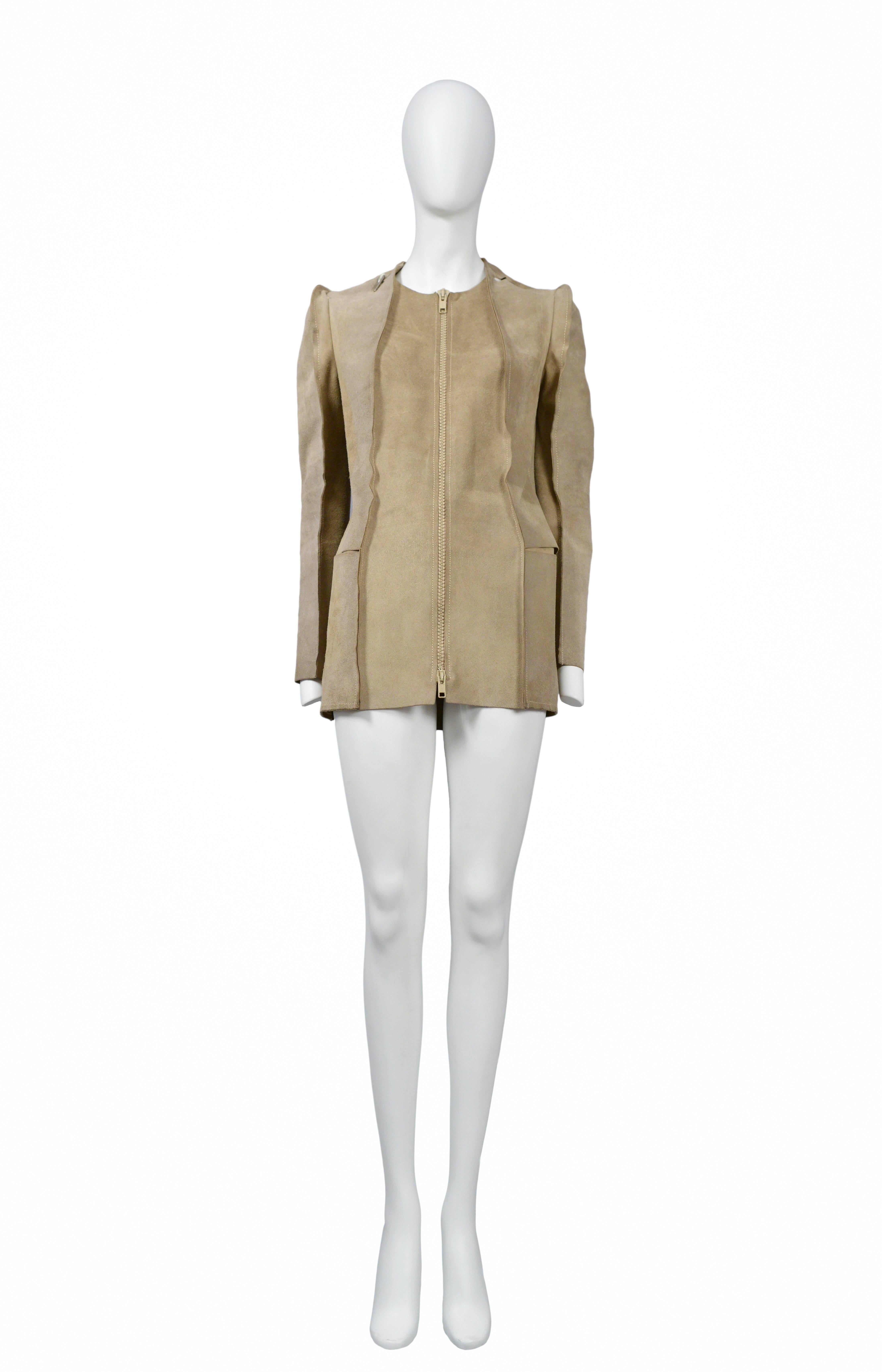 Vintage Maison Martin Margiela tan suede coat fashioned after a flat coat pattern. Coat features inside out seams, whole punches at shoulder and pattern hook detail. From the 1998 Collection.
Please inquire for additional images.
