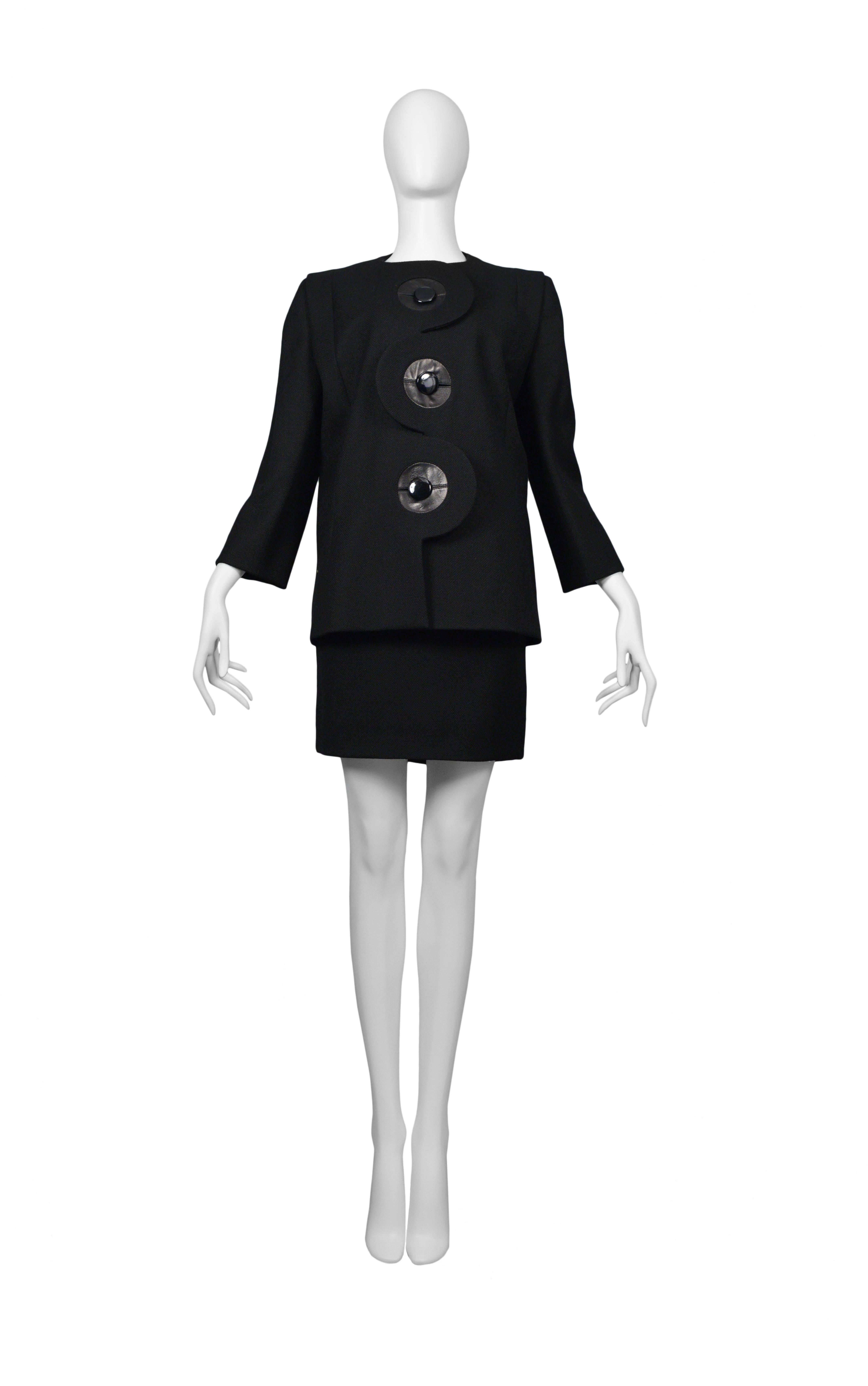 Pierre Cardin Couture black iconic suit. Leather trim at button holes. Circa, 1986-1993.
Please inquire for additional images.