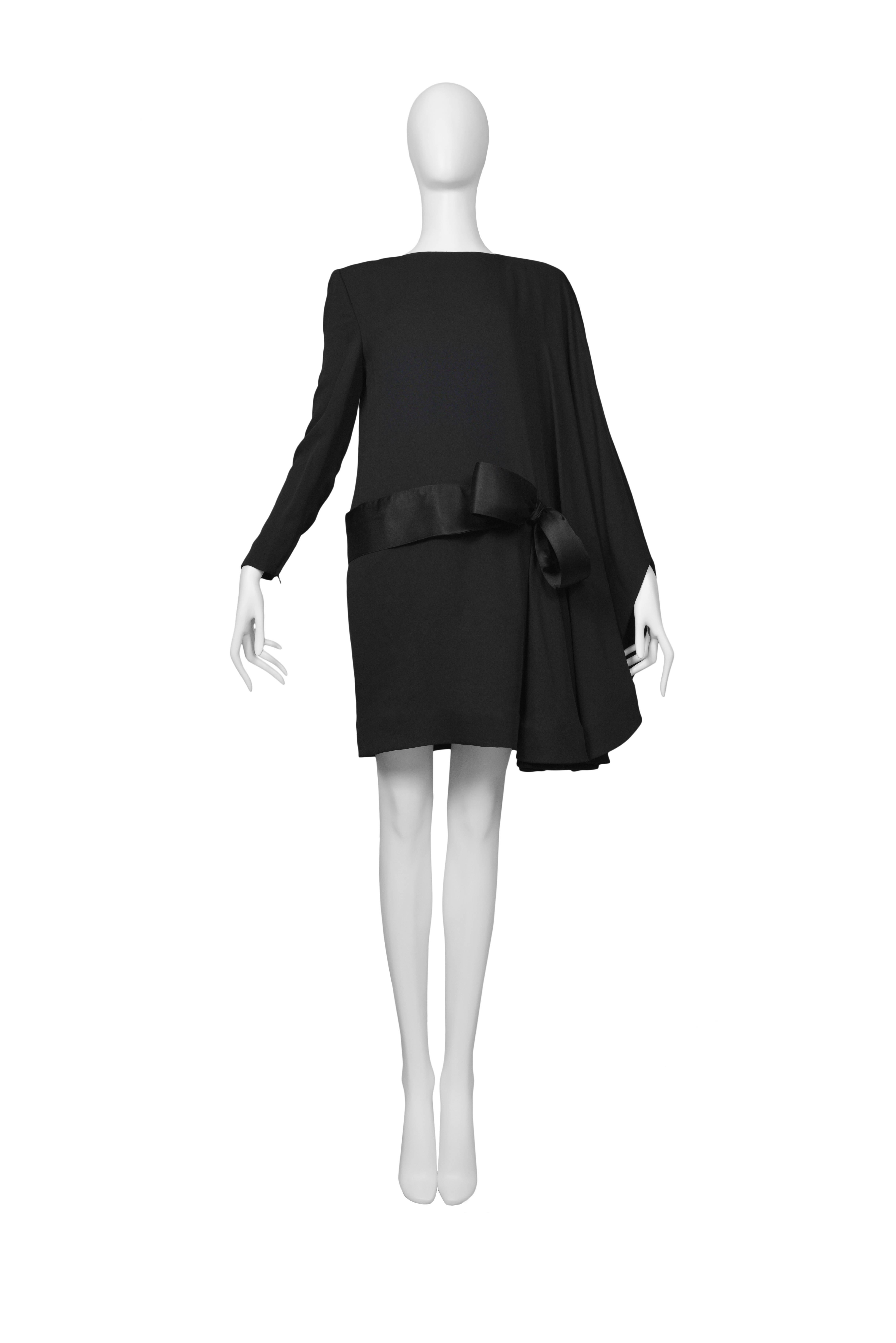 Pierre Cardin Couture origami black bow dress with large asymmetrical drape. Circa, 1986-1993.
Please inquire for additional images.