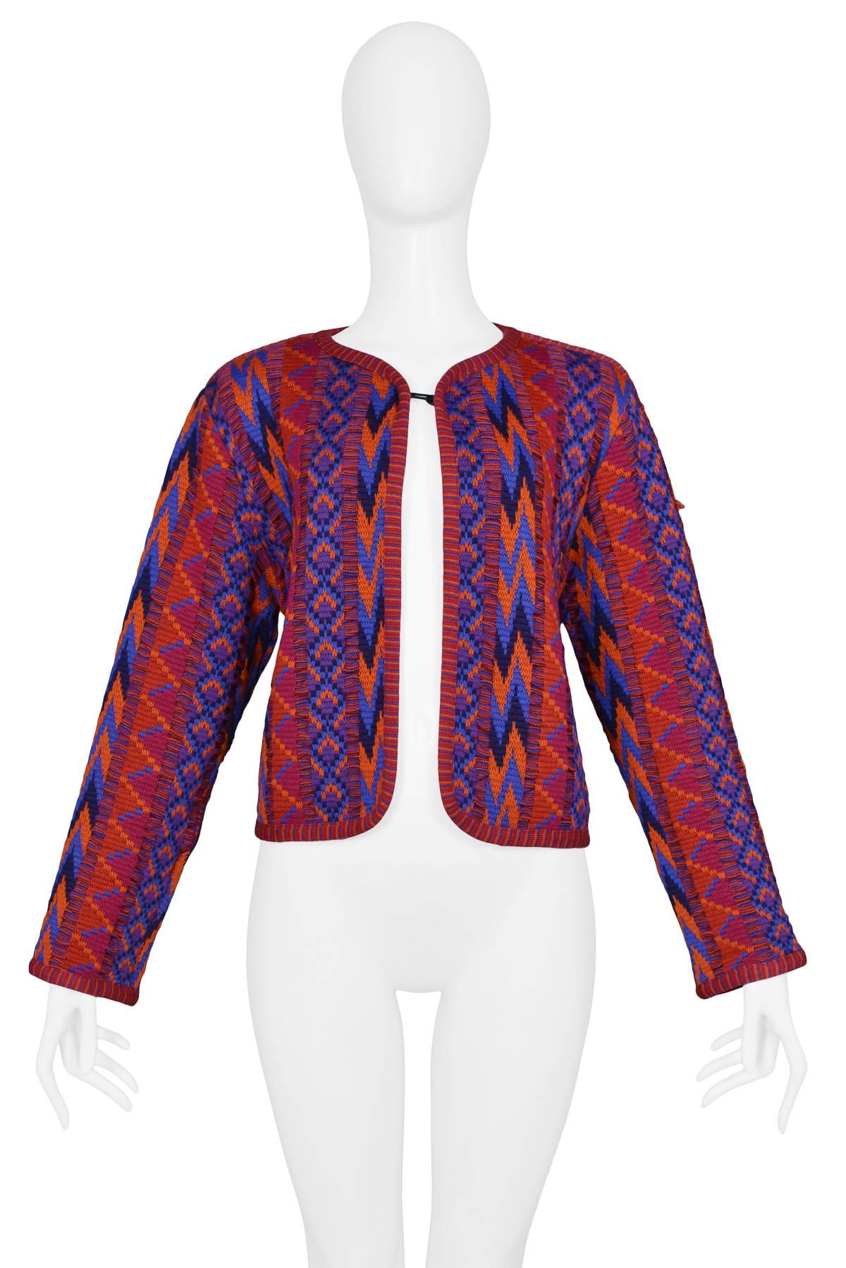 Vintage Yves Saint Laurent purple and fuchsia knit jacket featuring an allover tribal pattern.
Please inquire for additional images.