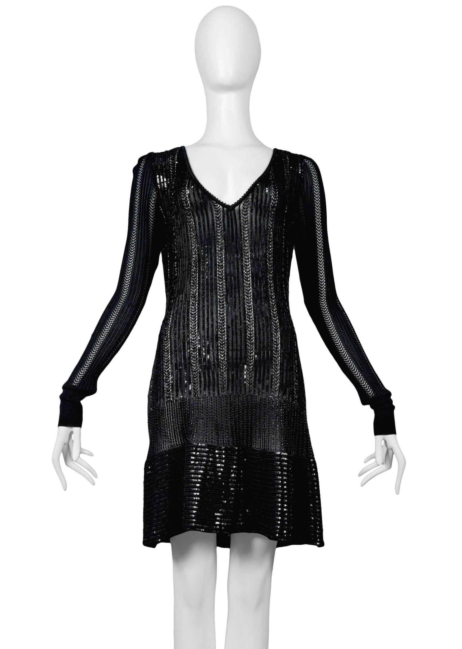 Vintage Azzedine Alaia black open and tight knit bodycon dress covered with black beads. Dress features slim body, slim long sleeves with cuffs, deep V neck and two panels of alternating beads. Stunning example from the 1996 collection. Excellent