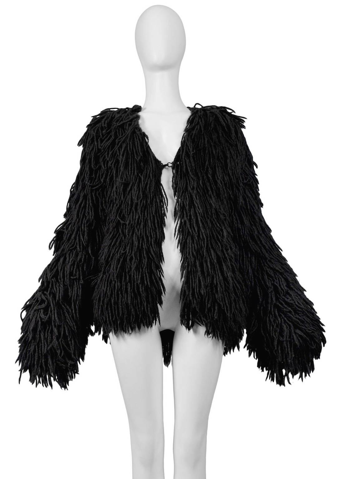 Resurrection Vintage is excited to offer a vintage Maison Martin Margiela black alpaca shag jacket featuring an easy oversized fit, all-over fringe, and hook and eye closure. 

Maison Martin Margiela
Size: One Size
Black Alpaca 
2003