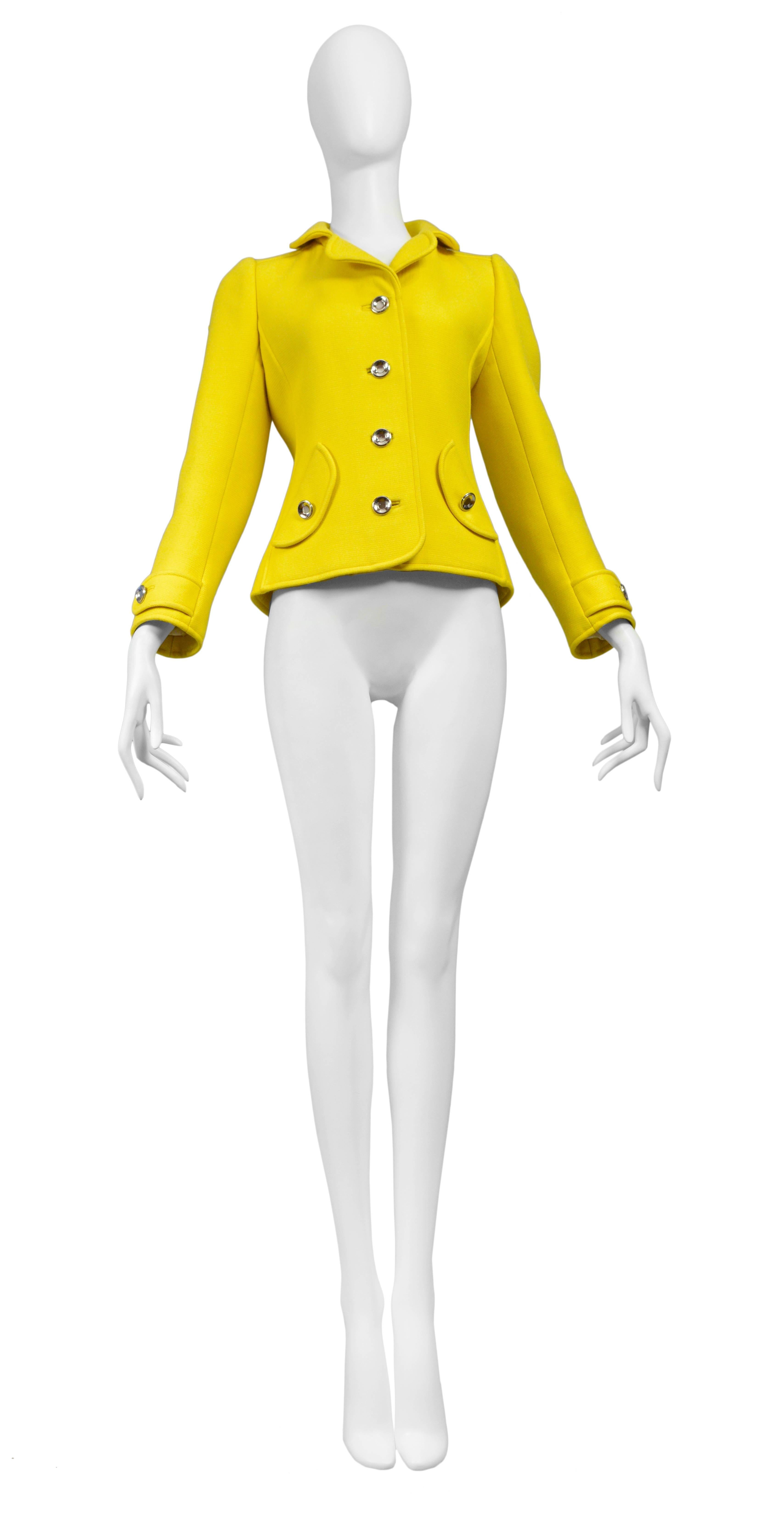 Vintage Courreges yellow jacket featuring a five metal button opening at the front, and two side pockets.
Please inquire for additional images.
