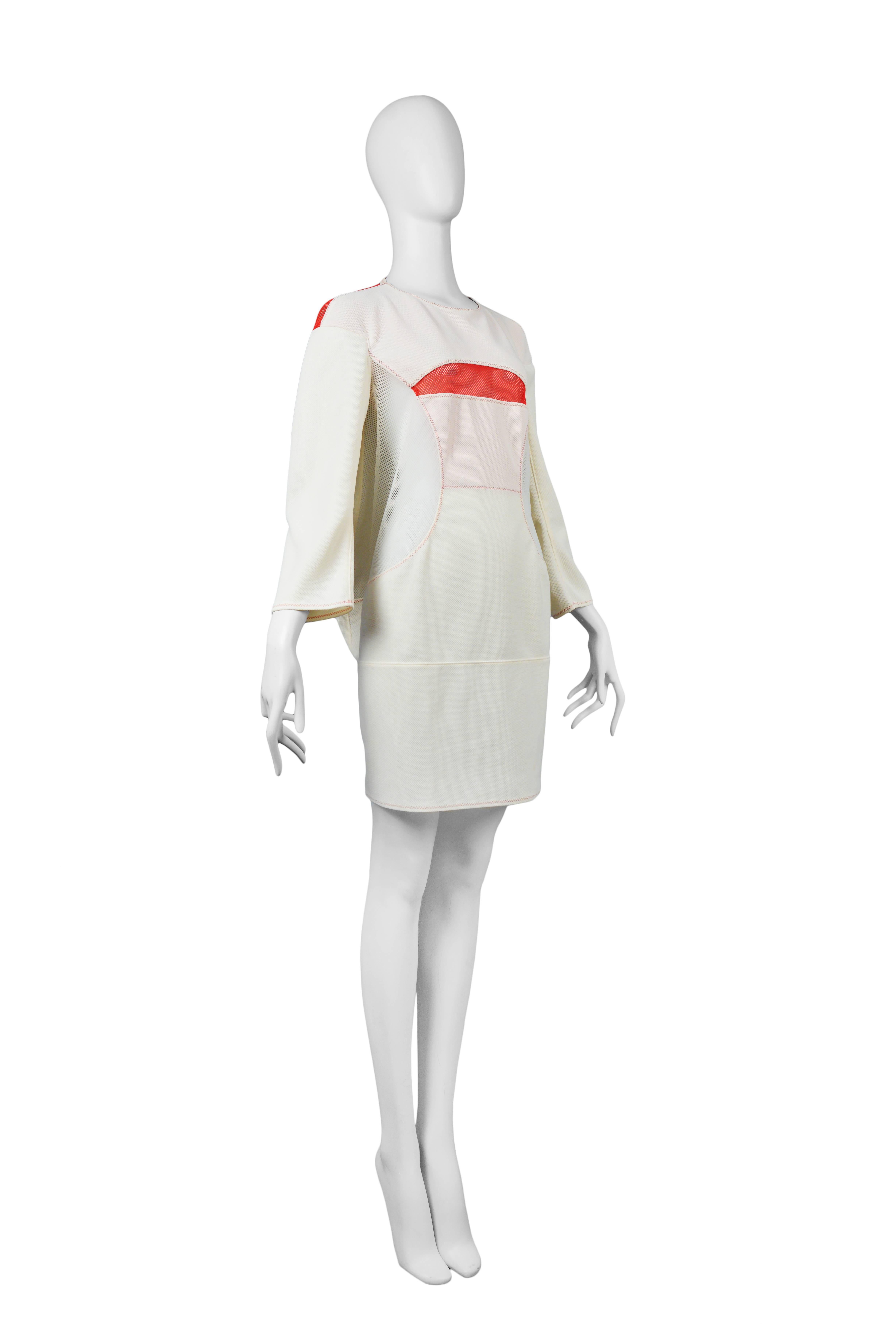 Vintage Junya Watanabe white tech dress featuring red mesh panels and long sleeves. Circa Spring / Summer 2013.
Please inquire for additional images.