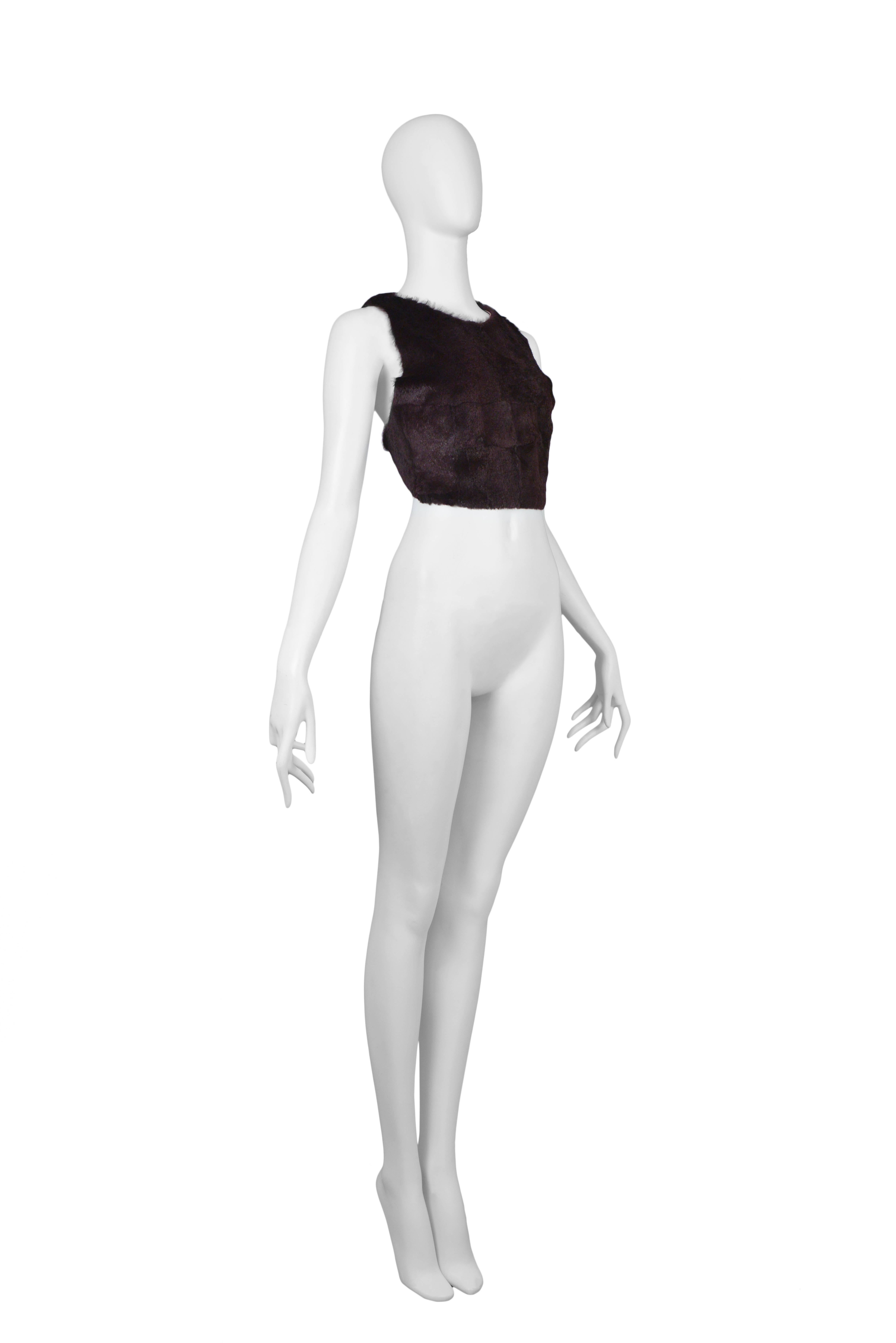 Vintage Maison Martin Margiela burgundy fur cropped apron halter top made with genuine leather featuring adjustable elastic straps that criss cross at the back. 
Please inquire for additional images.