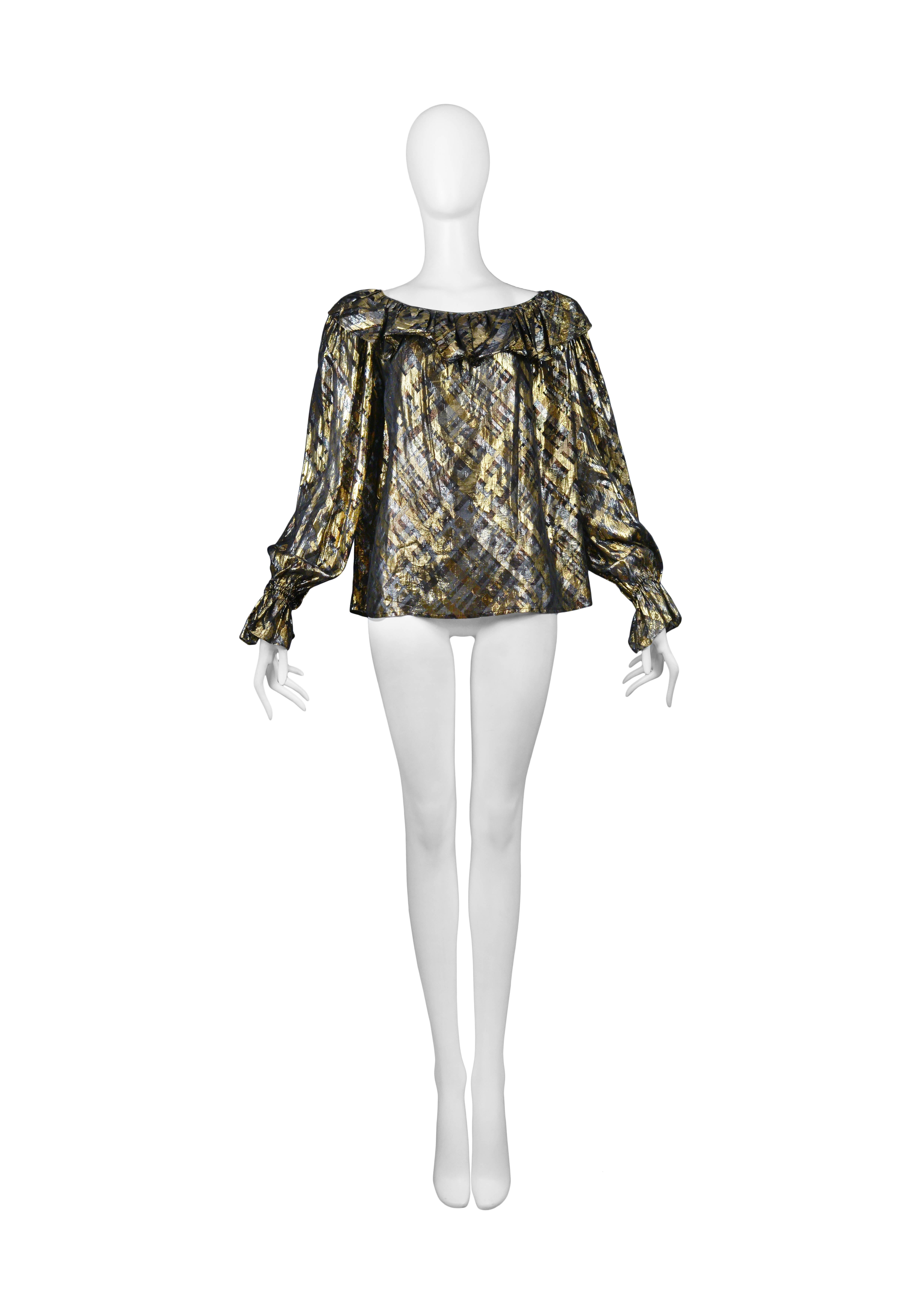 Vintage Yves Saint Laurent gold and grey plaid lame blouse featuring ruffle detailing along the neckline and cuffs.
Please inquire for additional images.