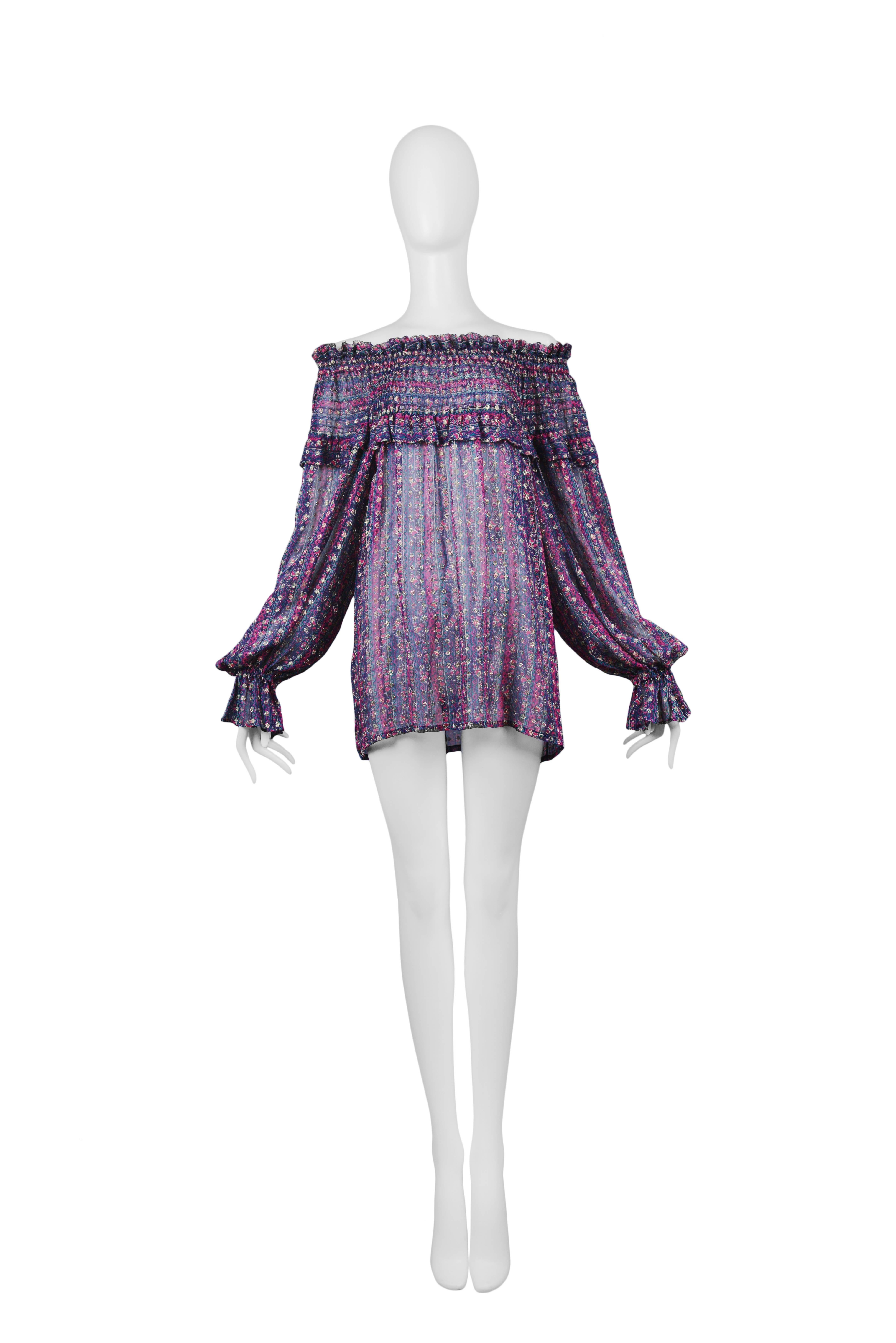 Vintage Yves Saint Laurent off the shoulder, purple and gold peasant blouse featuring smocking around the neckline and a small ruffle at the wrist. Circa 1970s. Please inquire for additional images.