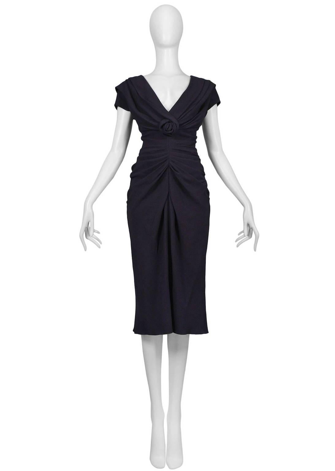 Vintage John Galliano for Christian Dior navy silk crepe dress with flower center detail and side zipper closure.