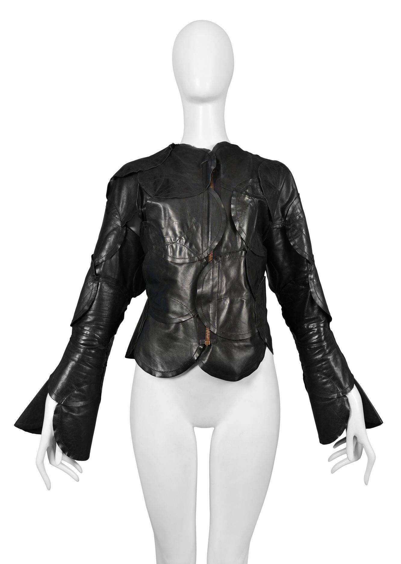 Vintage Maison Martin Margiela Artisanal Leather Circle Jacket. Pieces of black circular leather are sewn together to construct a jacket with front zipper closure.