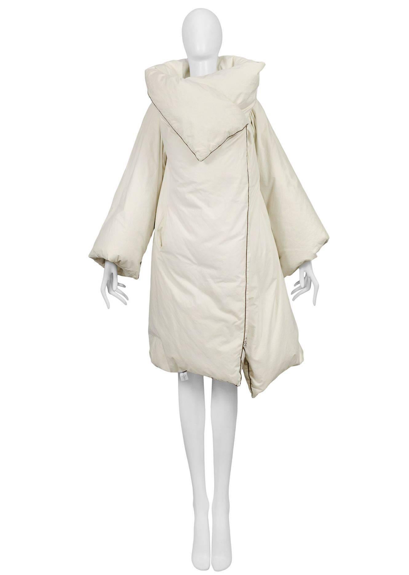 Original Maison Martin Margiela Artisanal Duvet Coat. Off white with brown trim coat made from a Featherlite 100% down filled duvet. Runway piece from the AW 1999.
In 1999 Maison Martin Margiela collaborated with Italian duvet and bedding