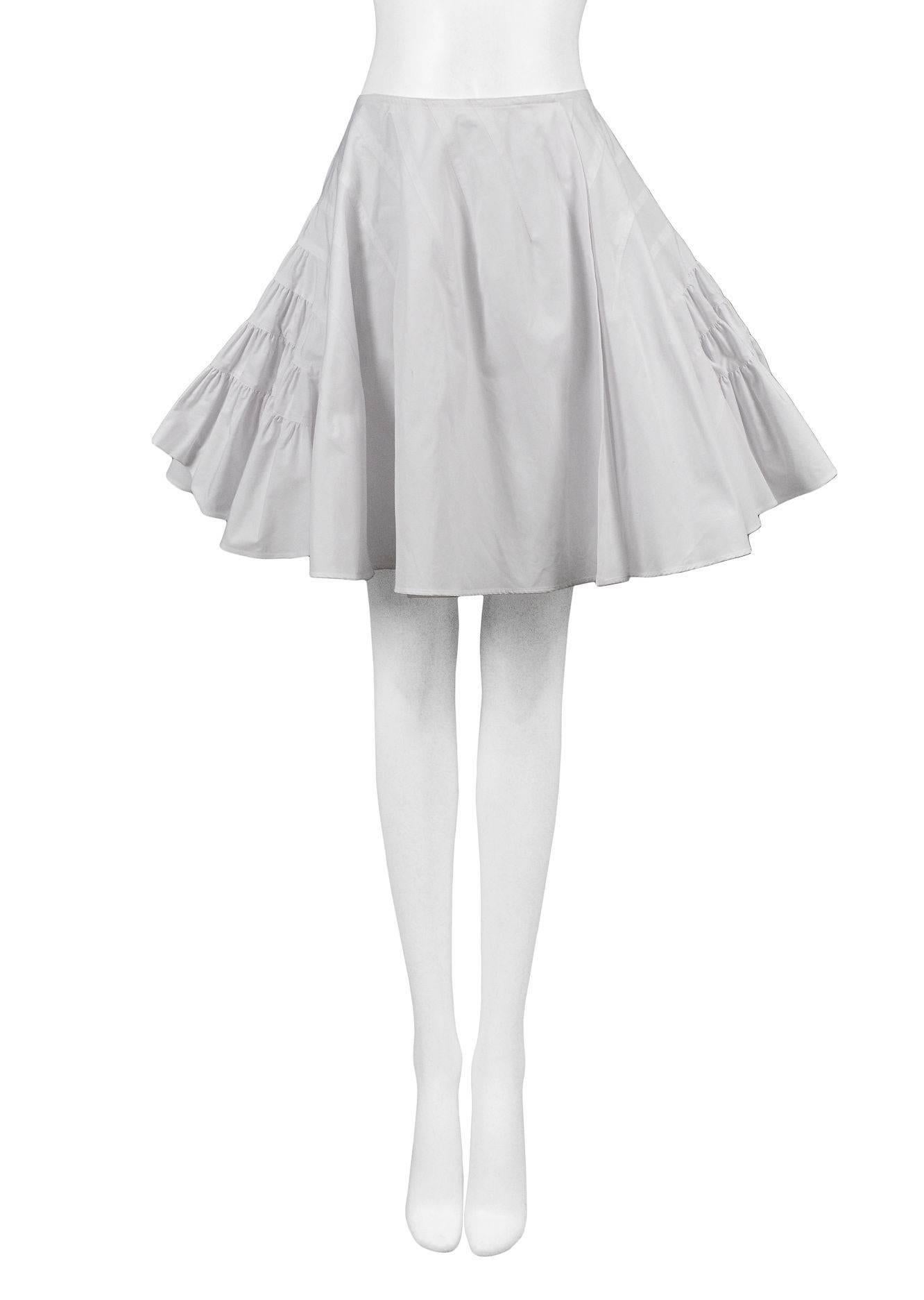 Alaia white multi tier skirt with curved seams.