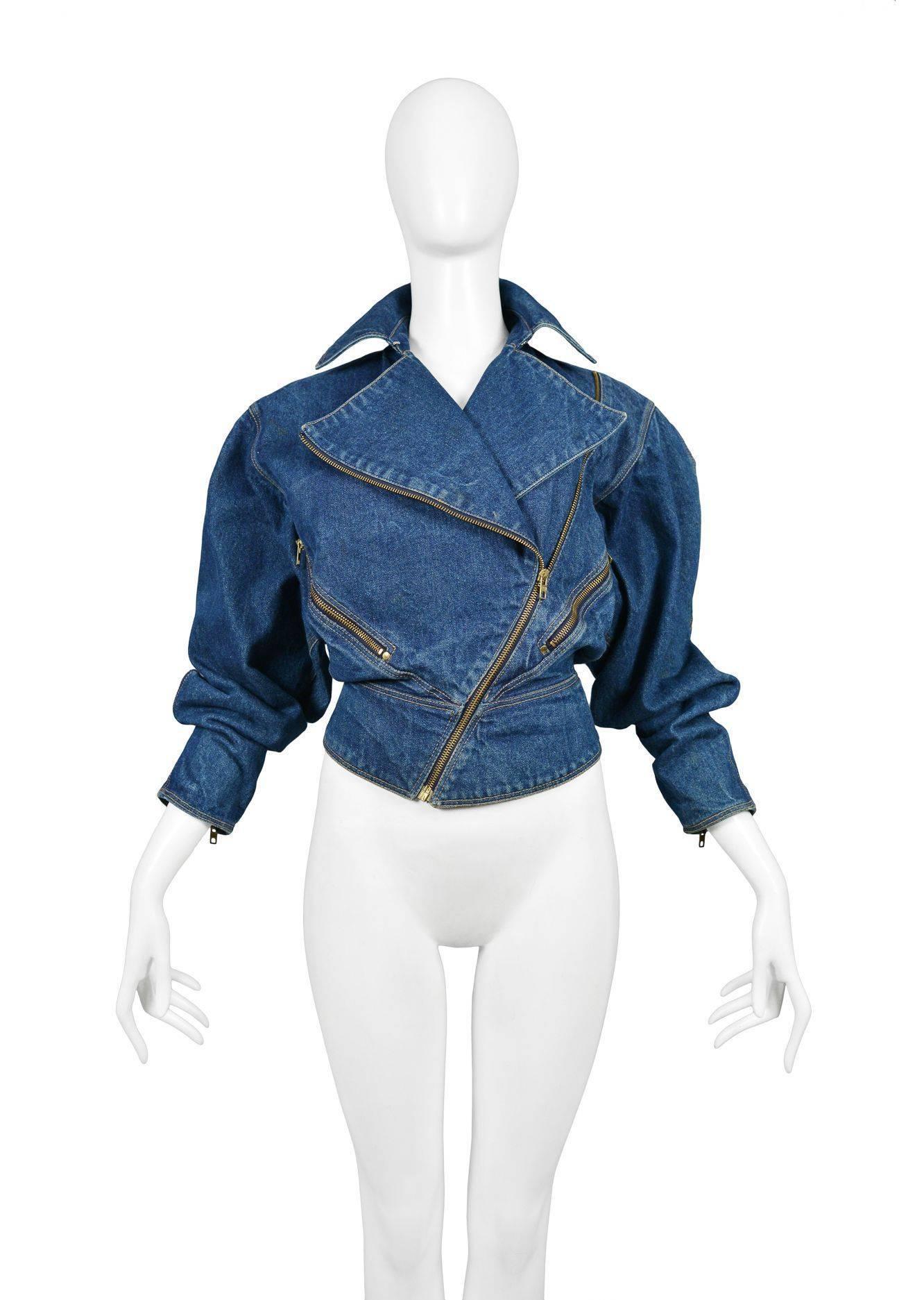 Vintage Alaia blue denim jacket with yellow stitching and curved zipper. Collection 1986.