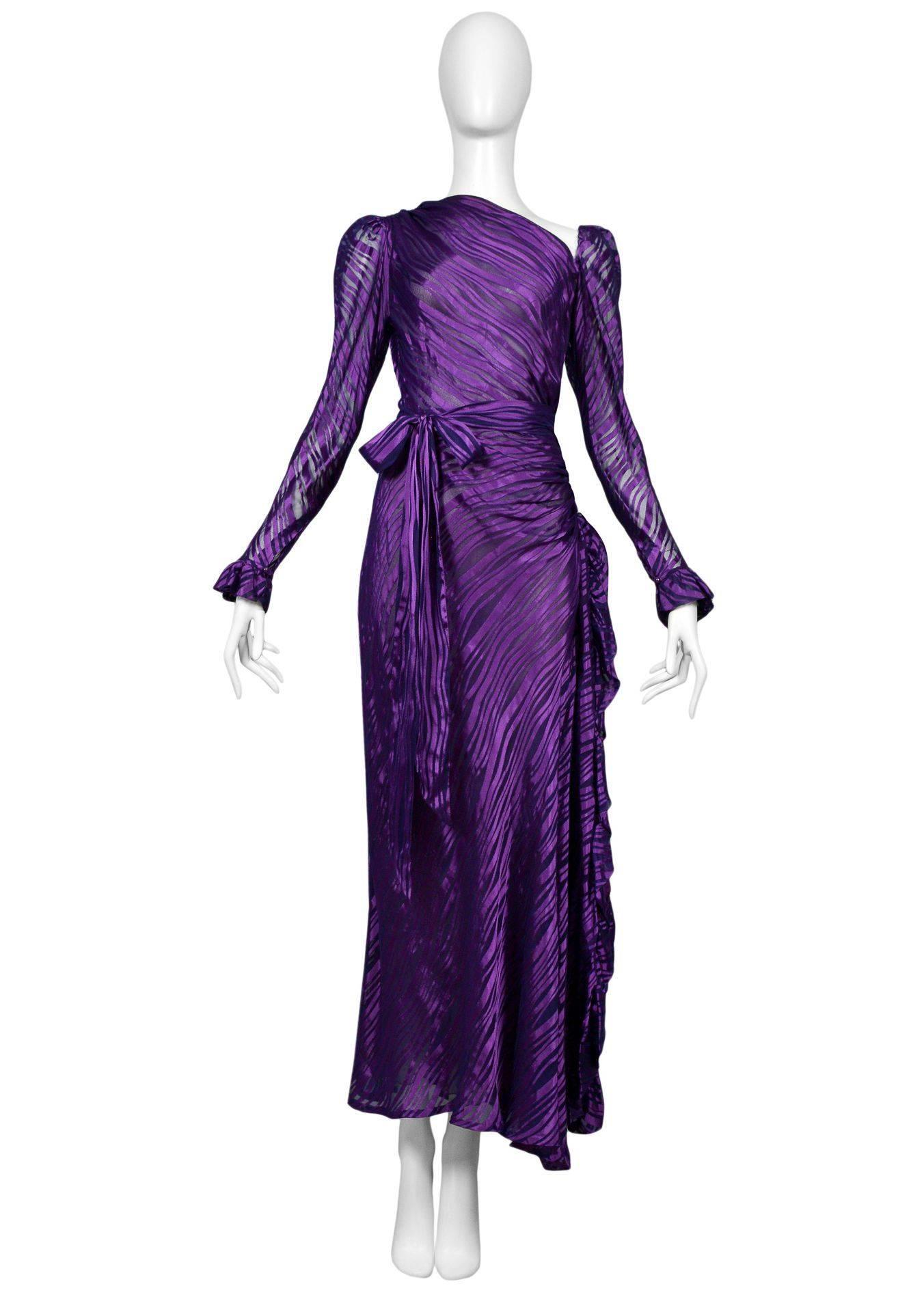 Vintage Yves Saint Laurent royal purple sheer satin gown. Featuring a ruffled high waist slit with matching waist sash. Collection 1980.