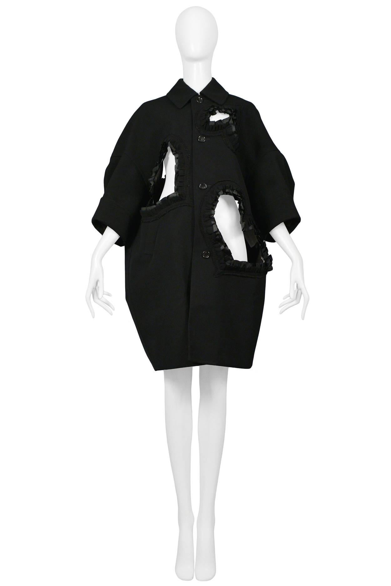 Comme des Garcons black cut out heart coat with ruffle ribbon trim from the "Bad Taste" collection. Featured on the runway AW 2008.