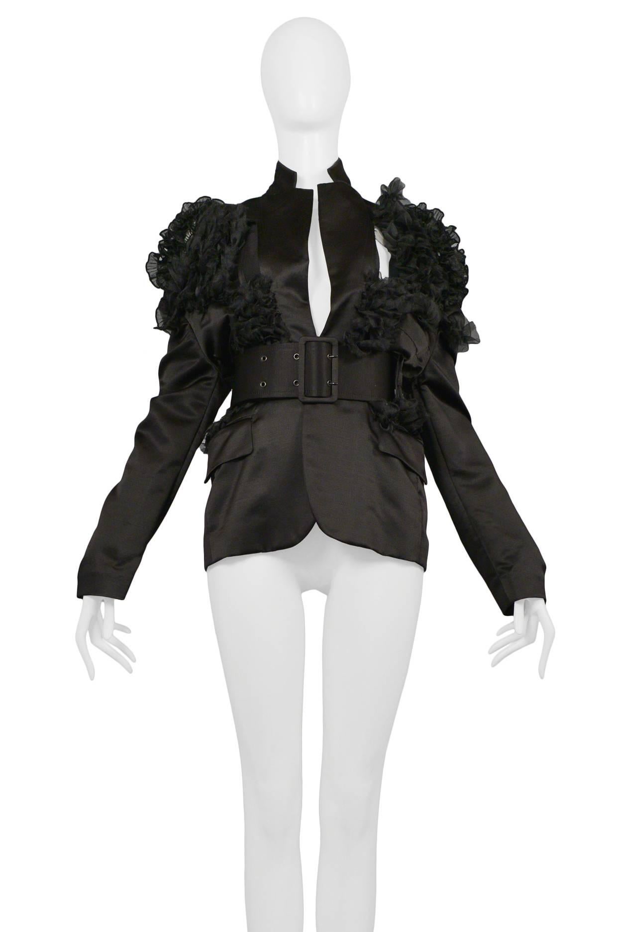 Vintage Comme des Garcons black satin pointed lapel blazer featuring ruffle organza detailing at the shoulders and torso and a matching wide buckle satin belt. Circa SS 2007.