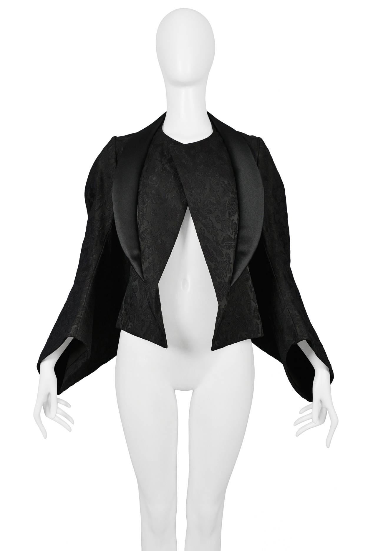Comme des Garcons black on black brocade kimono sleeve jacket featuring a black satin collar and a voluminous side profile. Circa Autumn / Winter 2004.