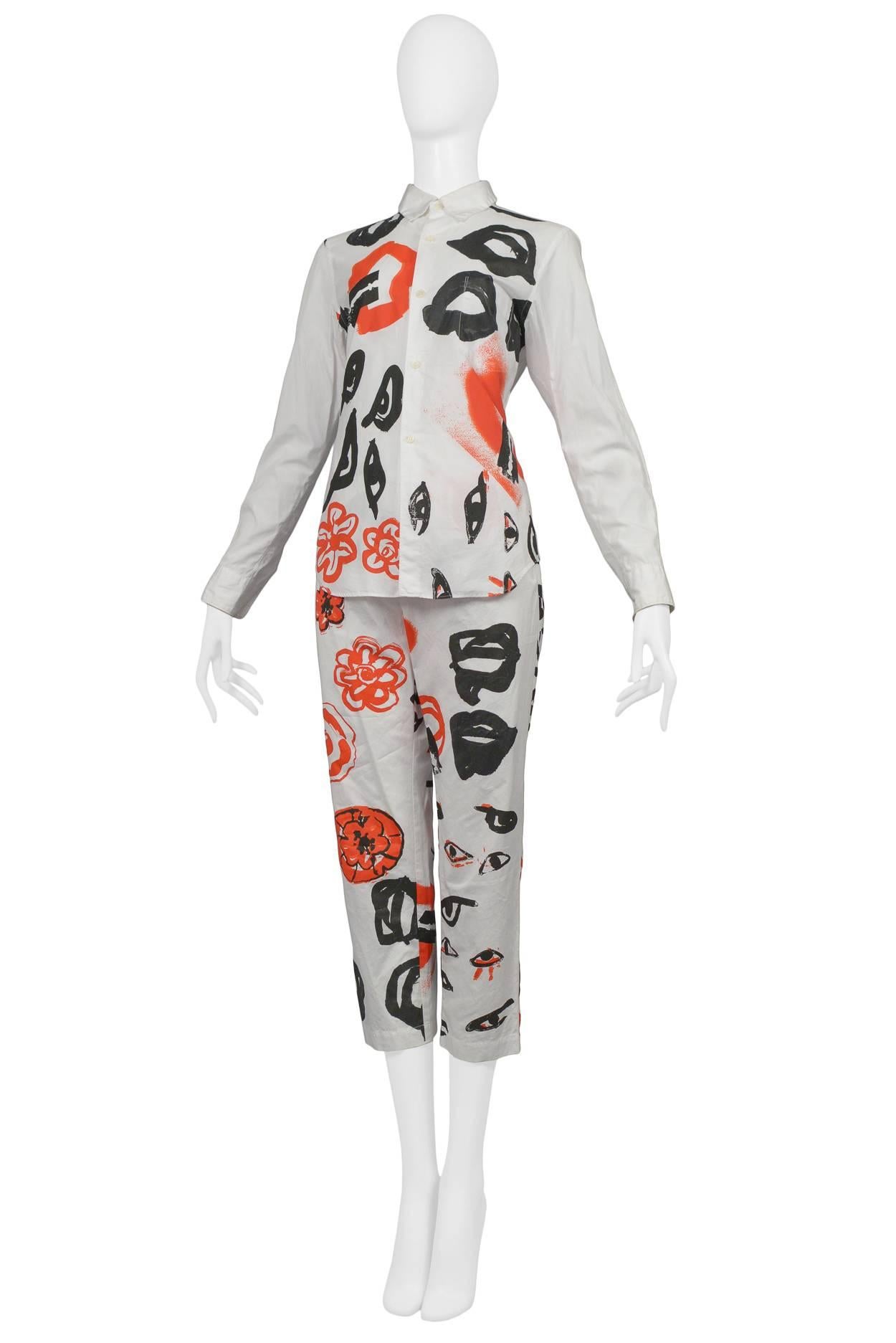 Vintage Comme des Garcons white cotton pant ensemble with eye, razor blade and graphic prints. Collection AW 2000.